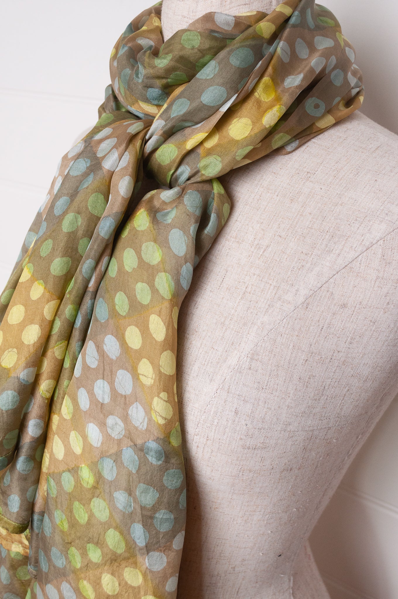 Pure silk shibori dyed  scarf in bands of aqua and light olive.
