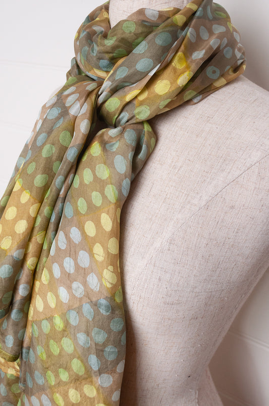 Pure silk shibori dyed  scarf in bands of aqua and light olive.