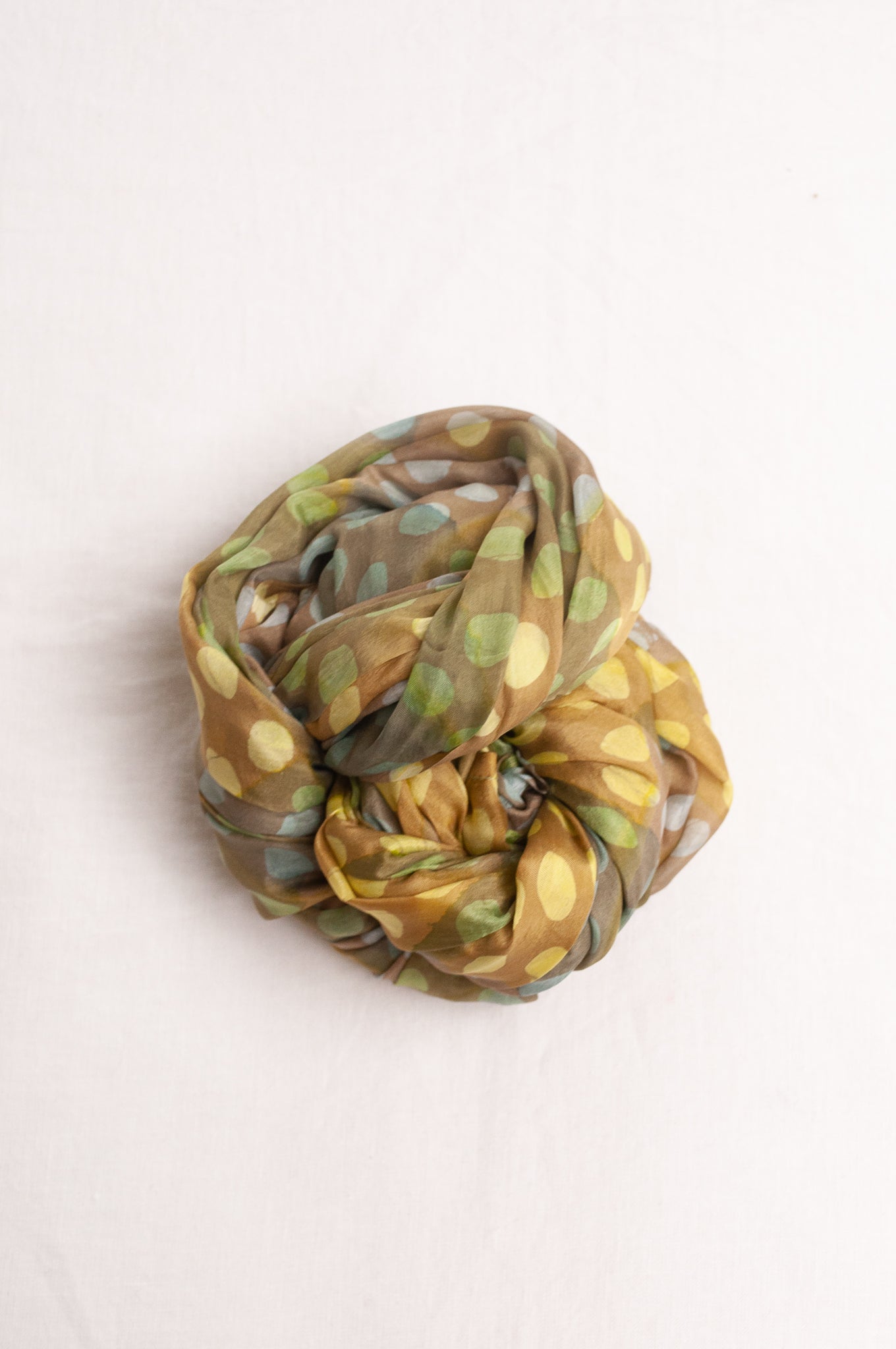 Pure silk shibori dyed  scarf in bands of aqua and light olive.