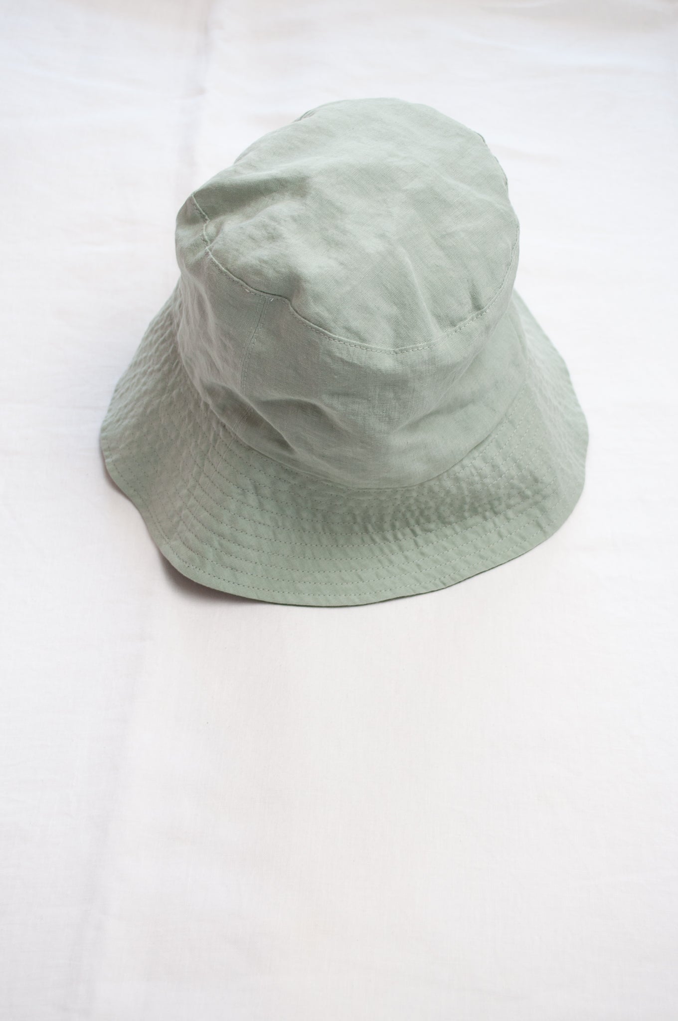 PCNQ Luna made in Japan mint green foldable linen fabric bucket hat.