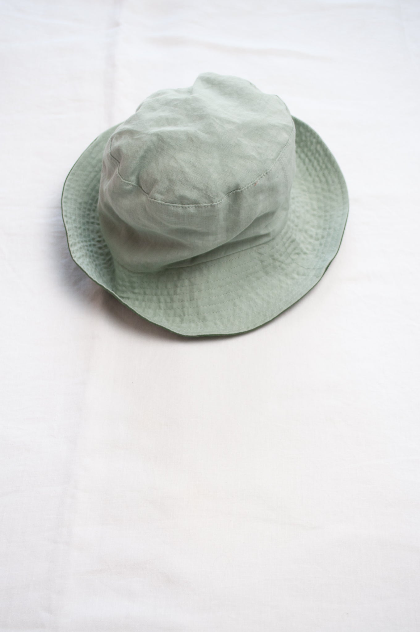PCNQ Luna made in Japan mint green foldable linen fabric bucket hat.