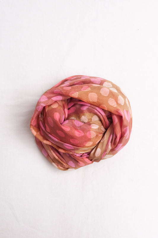 Pure silk shibori dyed  scarf in bands of pink and golden brown.