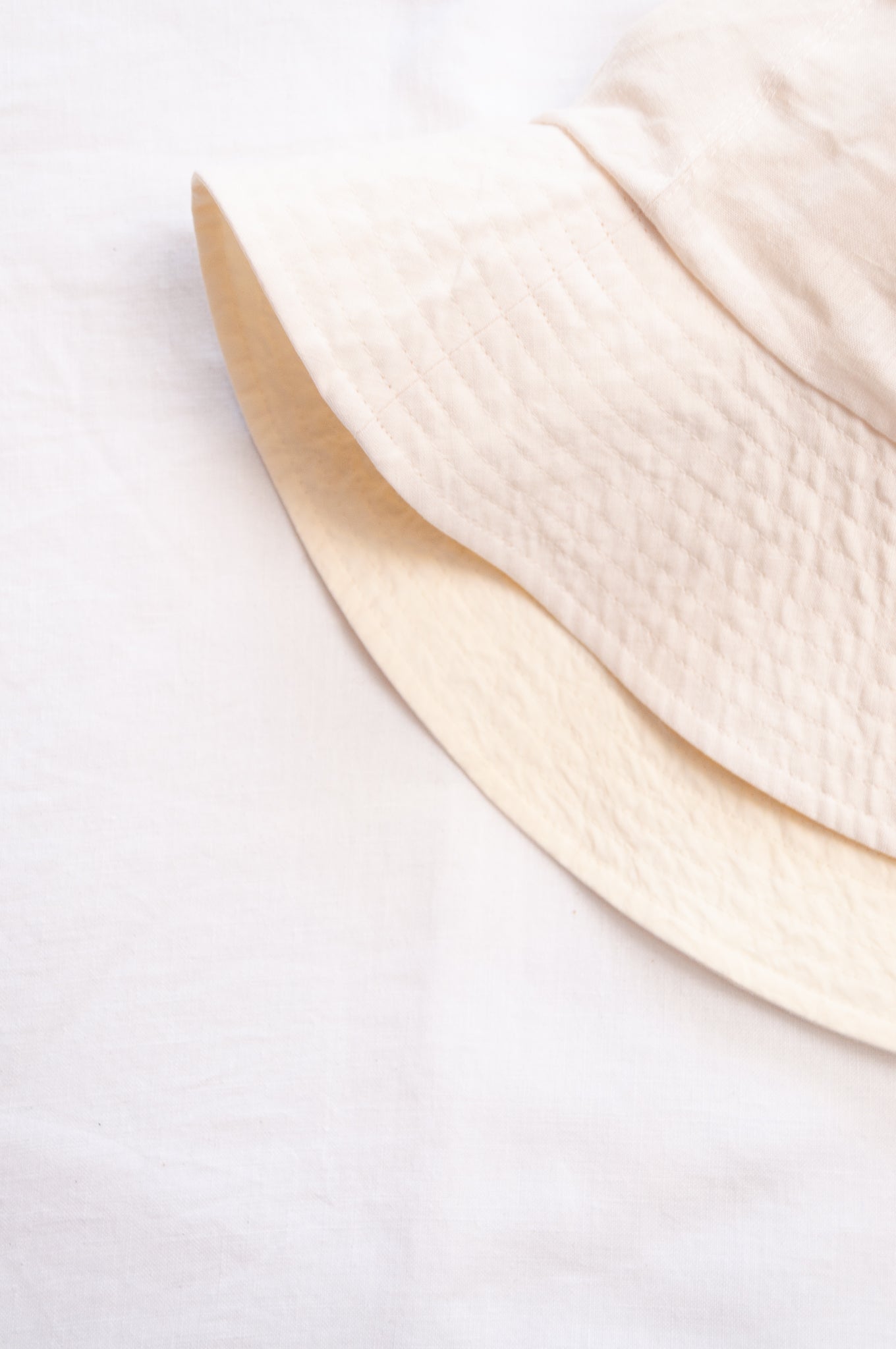 PCNQ Luna made in Japan ivory white foldable linen fabric bucket hat.