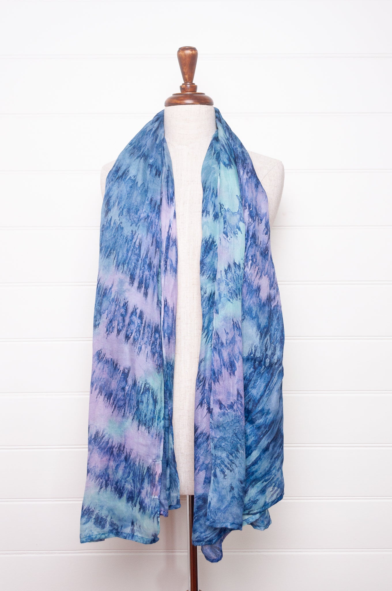Pure silk shibori dyed scarf in shades of blue and purple.