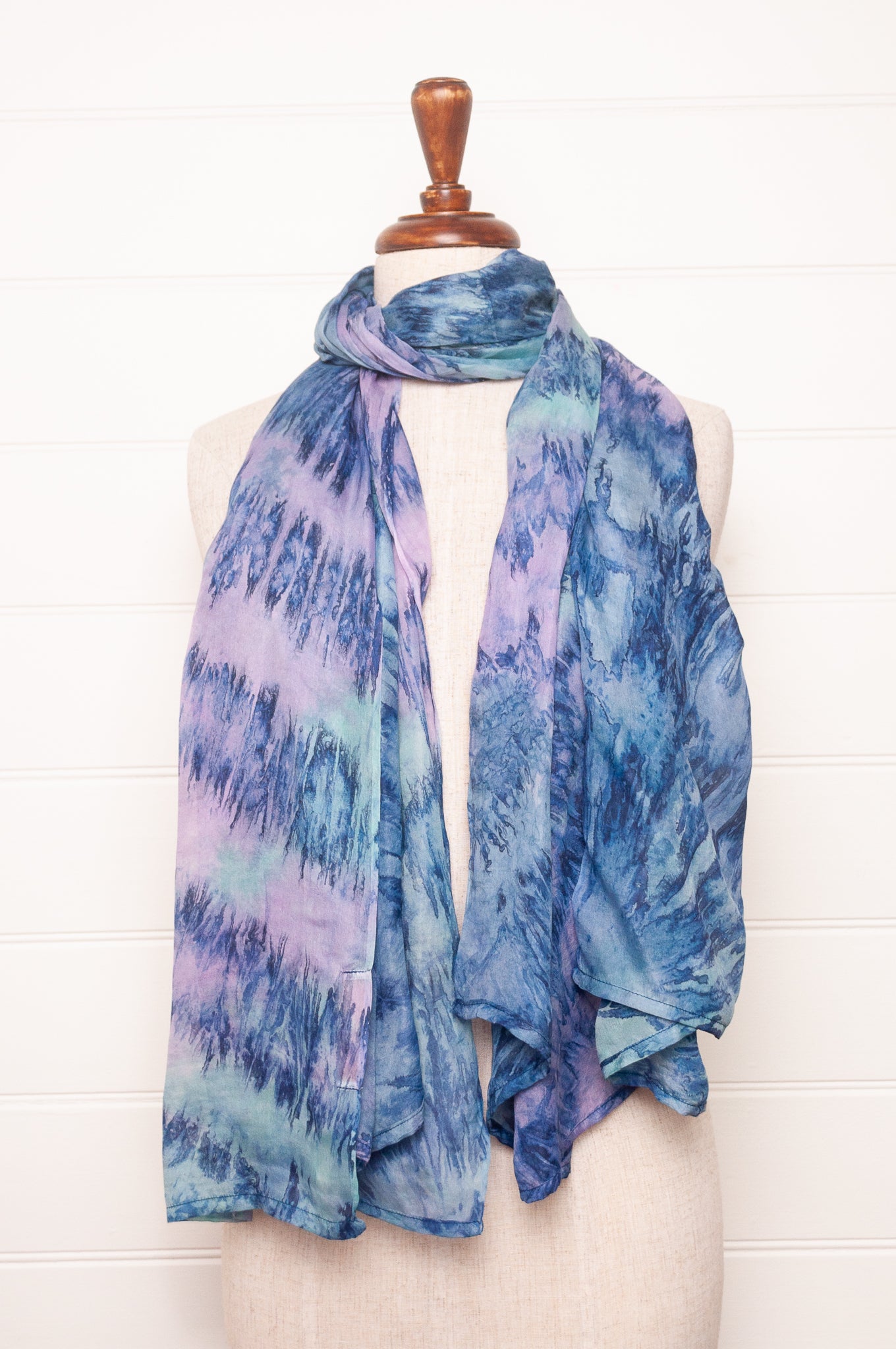 Pure silk shibori dyed scarf in shades of blue and purple.