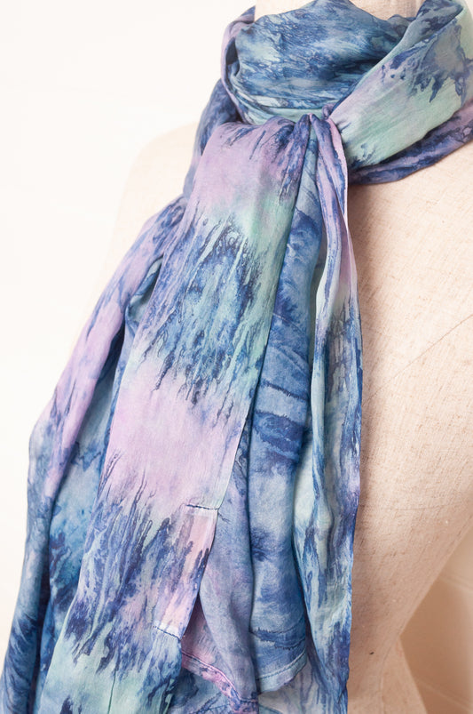 Pure silk shibori dyed scarf in shades of blue and purple.