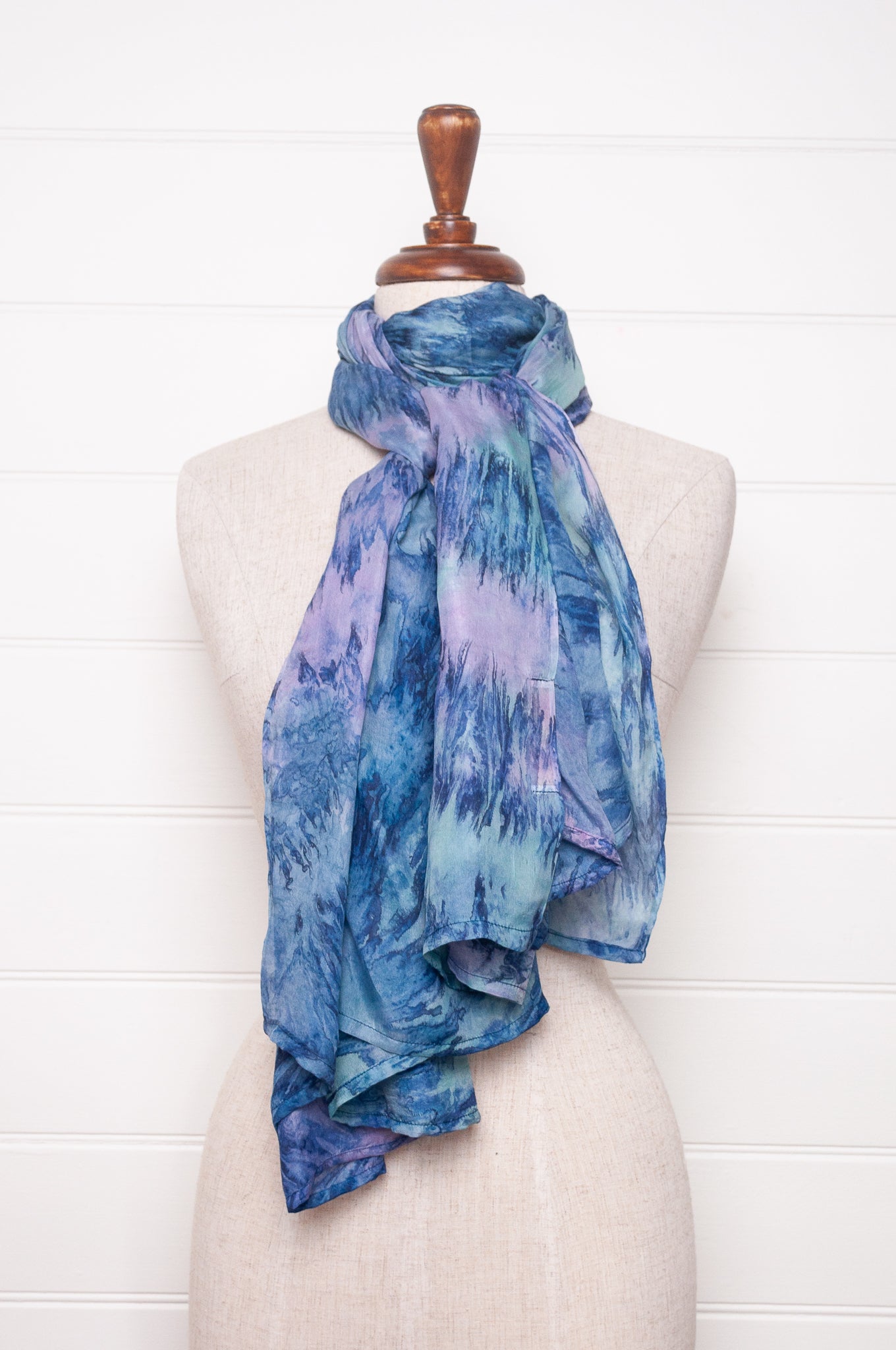 Pure silk shibori dyed scarf in shades of blue and purple.