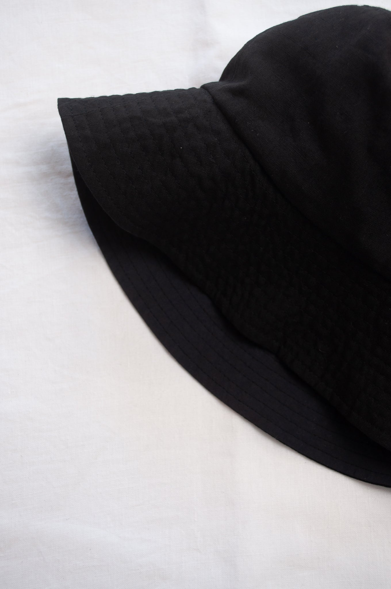 PCNQ Luna made in Japan black foldable linen fabric bucket hat.