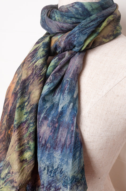 Pure silk shibori dyed scarf in shades of blues, greens and browns.