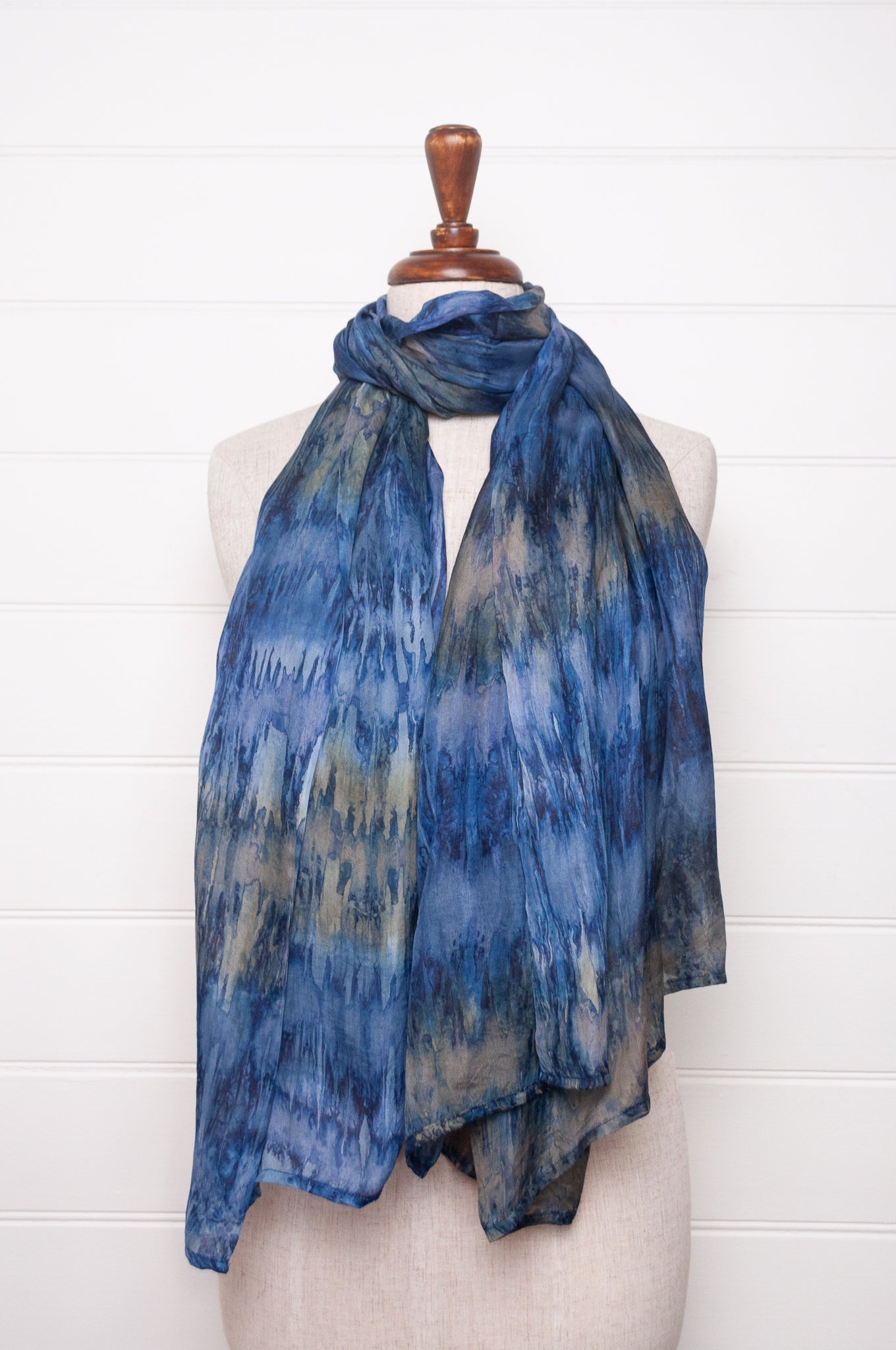 Pure silk shibori dyed scarf in shades of denim blue.