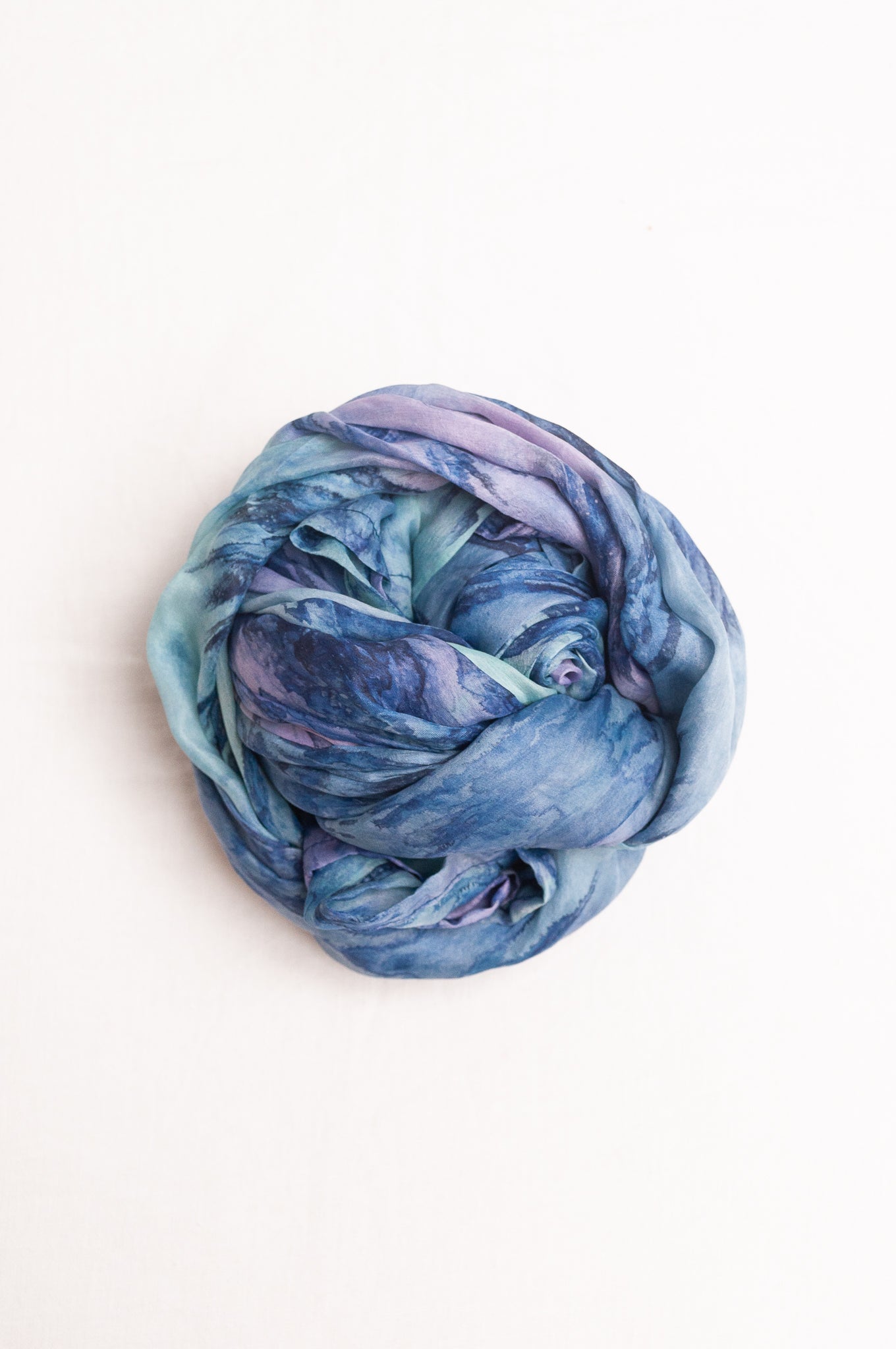Pure silk shibori dyed scarf in shades of blue and purple.
