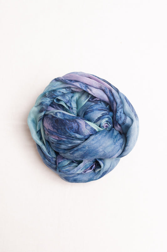 Pure silk shibori dyed scarf in shades of blue and purple.