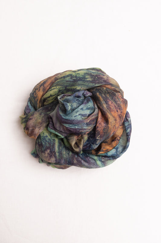 Pure silk shibori dyed scarf in shades of blues, greens and browns.