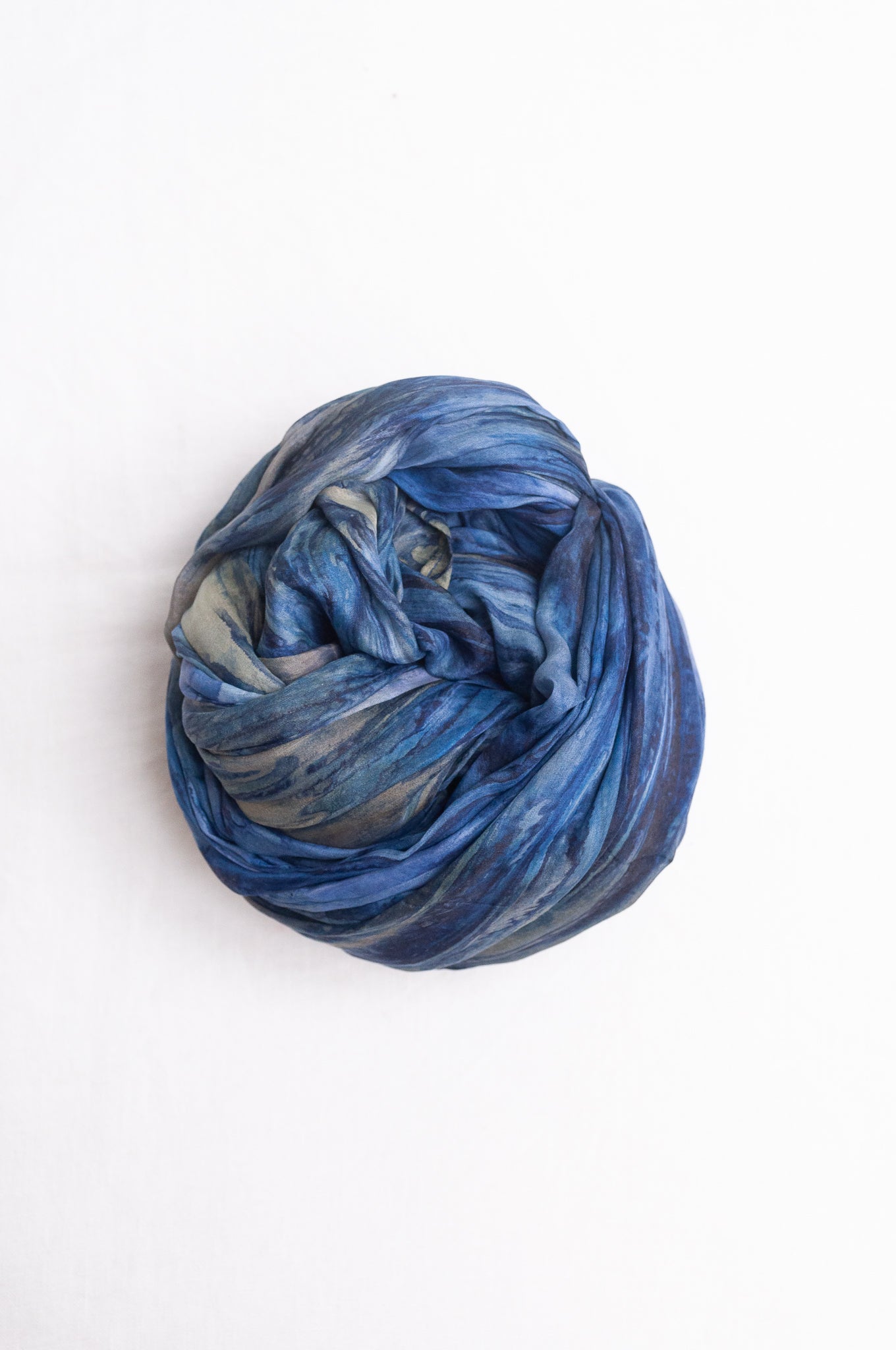 Pure silk shibori dyed scarf in shades of denim blue.