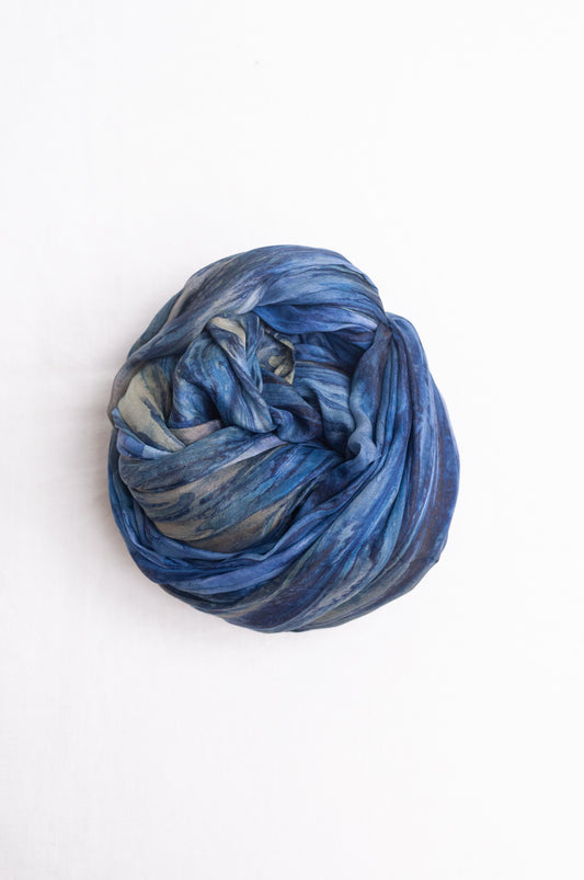 Pure silk shibori dyed scarf in shades of denim blue.