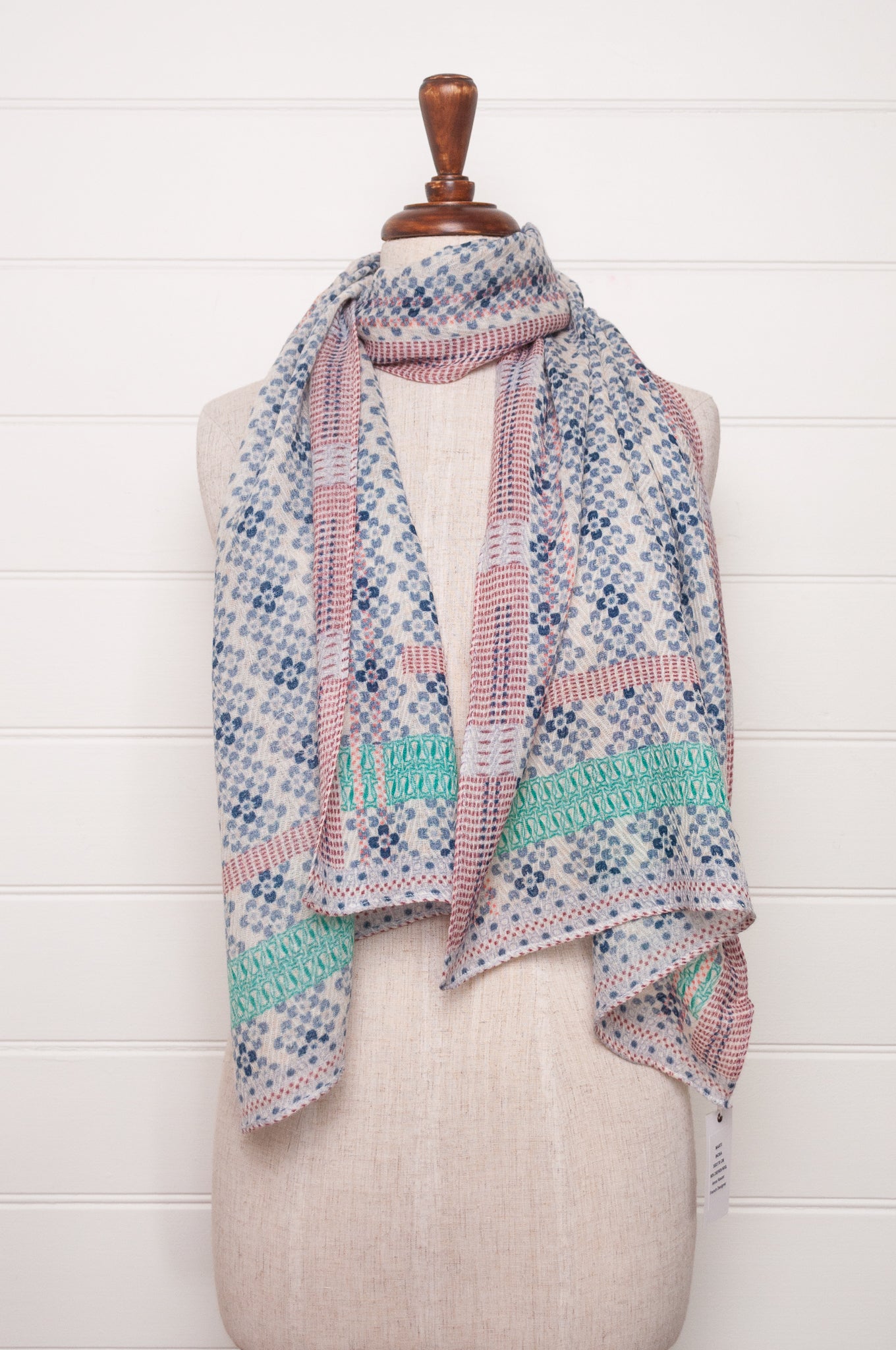 Anna Kaszer fine wool scarf Marti Inosa blue and white geometric flower pattern with green and red highlights.