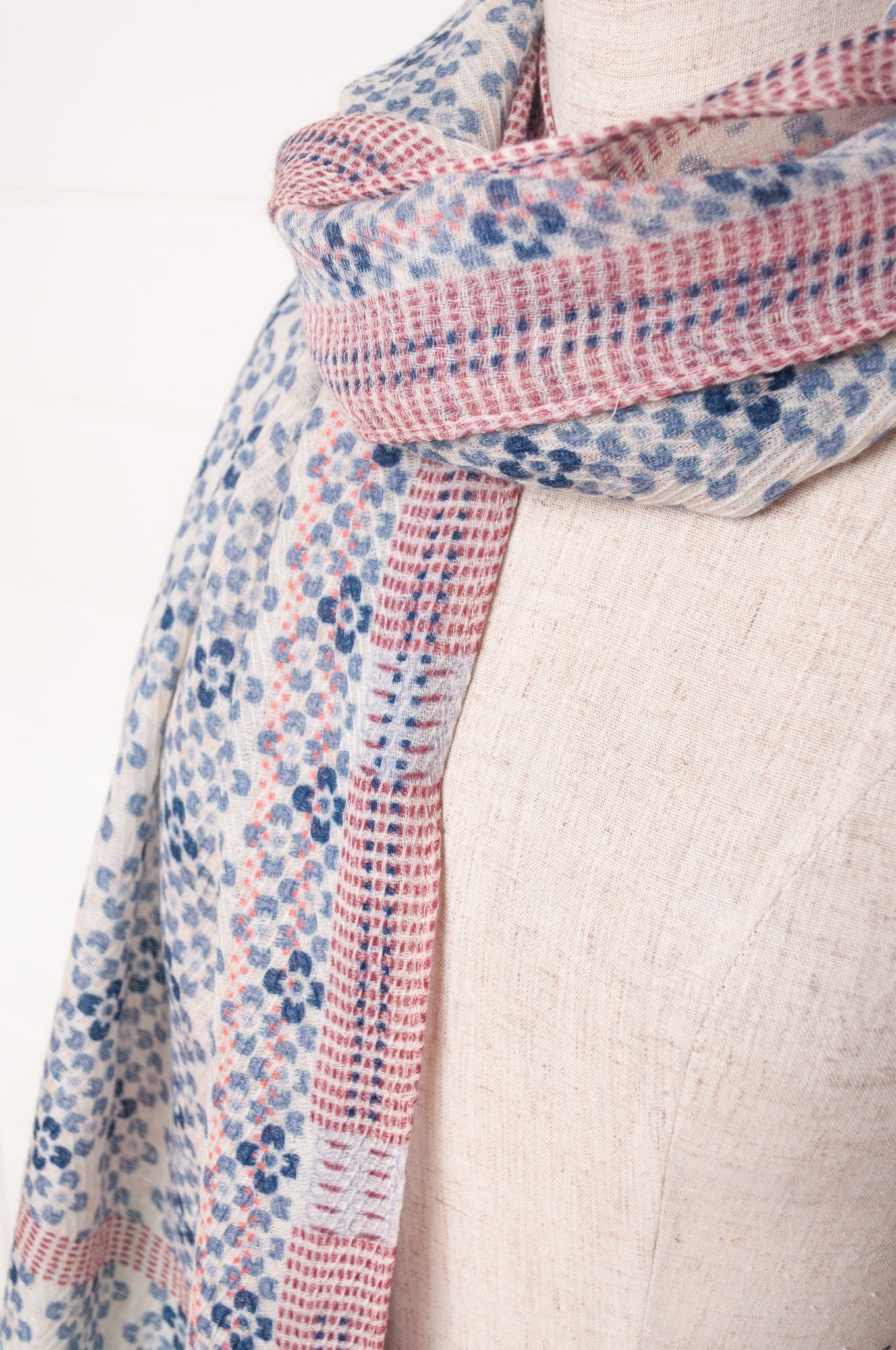 Anna Kaszer fine wool scarf Marti Inosa blue and white geometric flower pattern with green and red highlights.