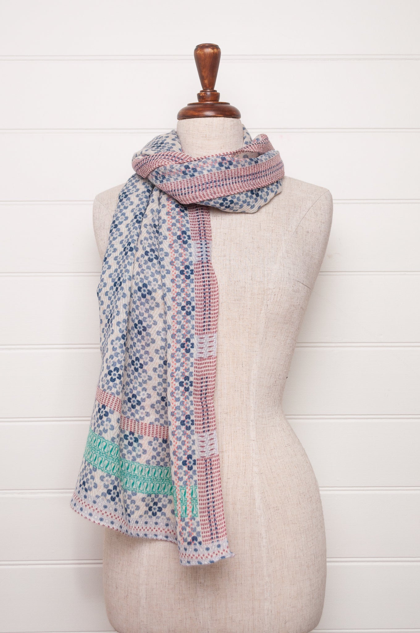 Anna Kaszer fine wool scarf Marti Inosa blue and white geometric flower pattern with green and red highlights.