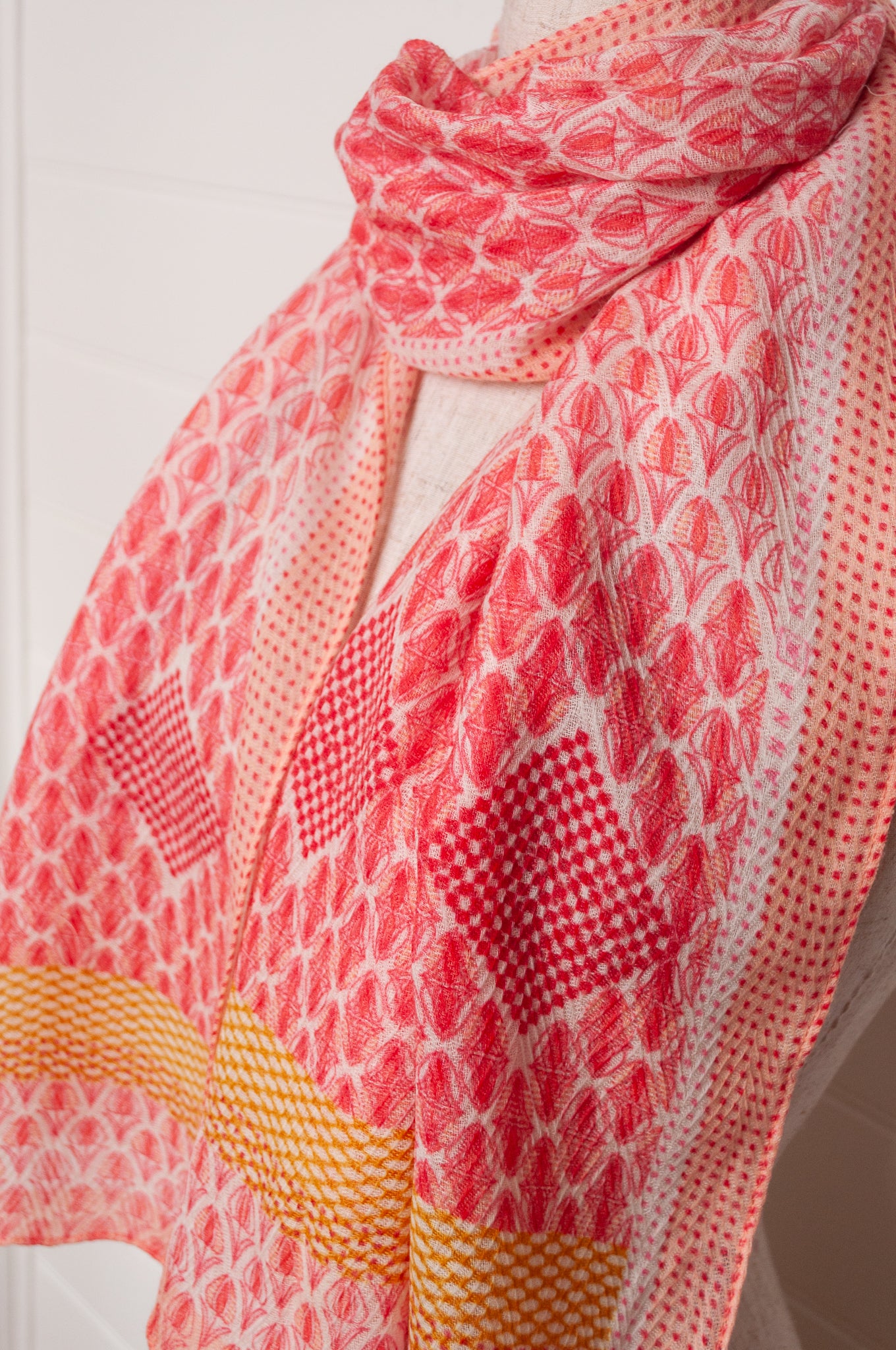 Anna Kaszer fine wool scarf geometric pattern in coral, white and mustard.