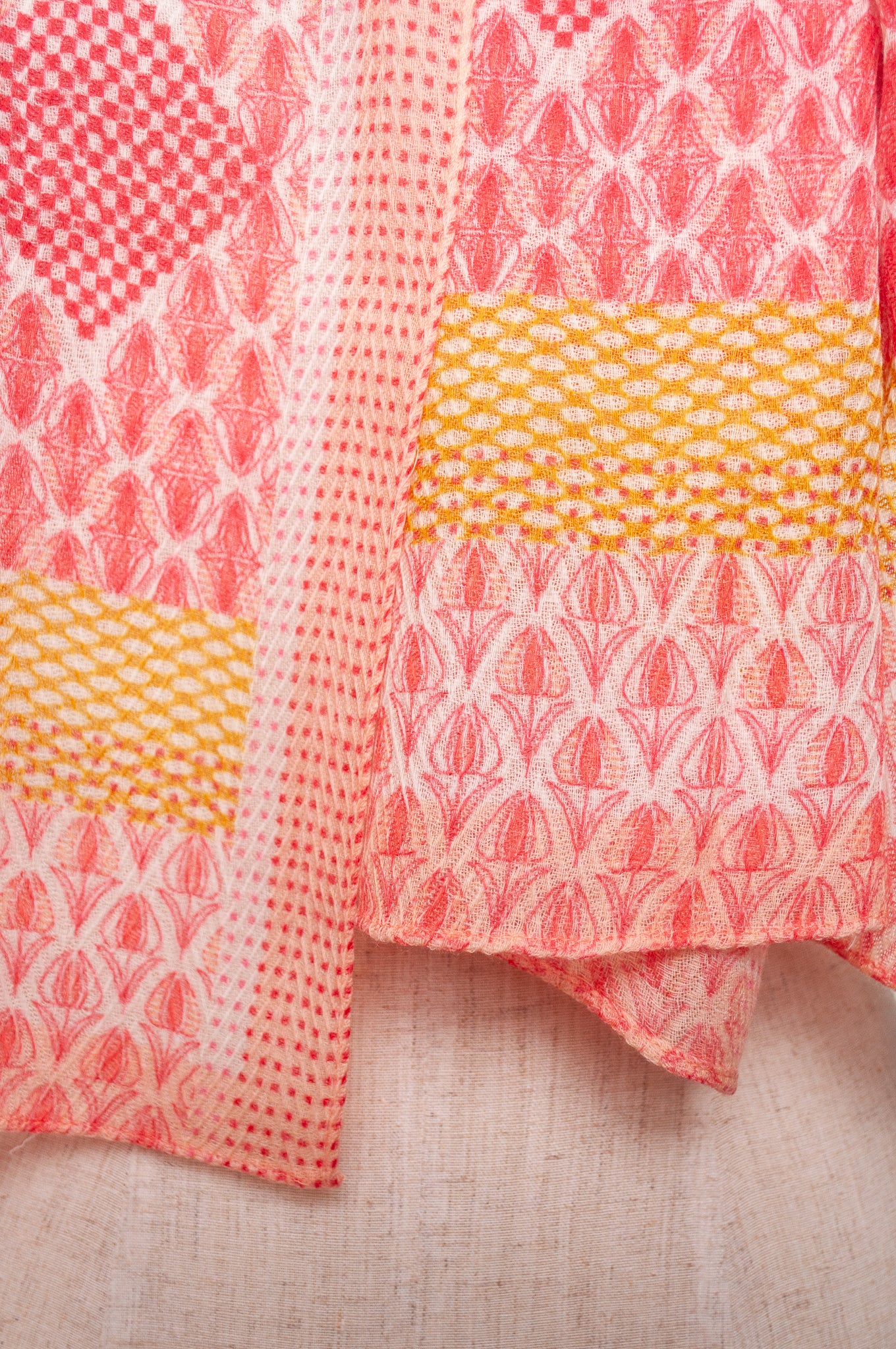 Anna Kaszer fine wool scarf geometric pattern in coral, white and mustard.