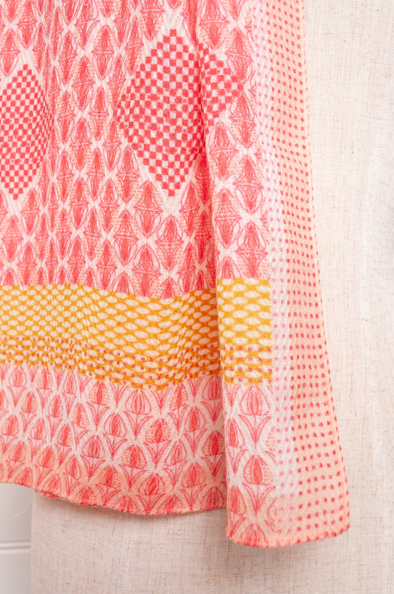Anna Kaszer fine wool scarf geometric pattern in coral, white and mustard.