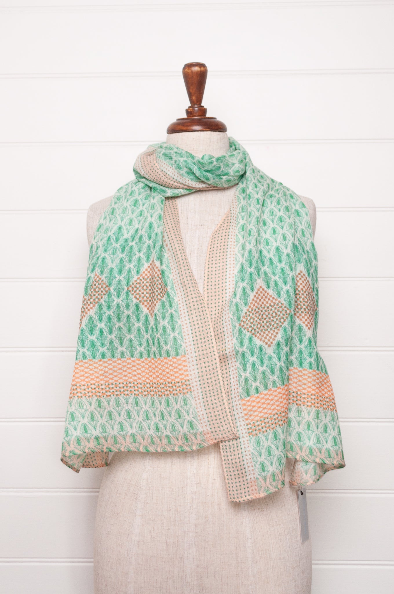 Anna Kaszer fine wool scarf Pouki tonic green and white geometric with coral highlights.