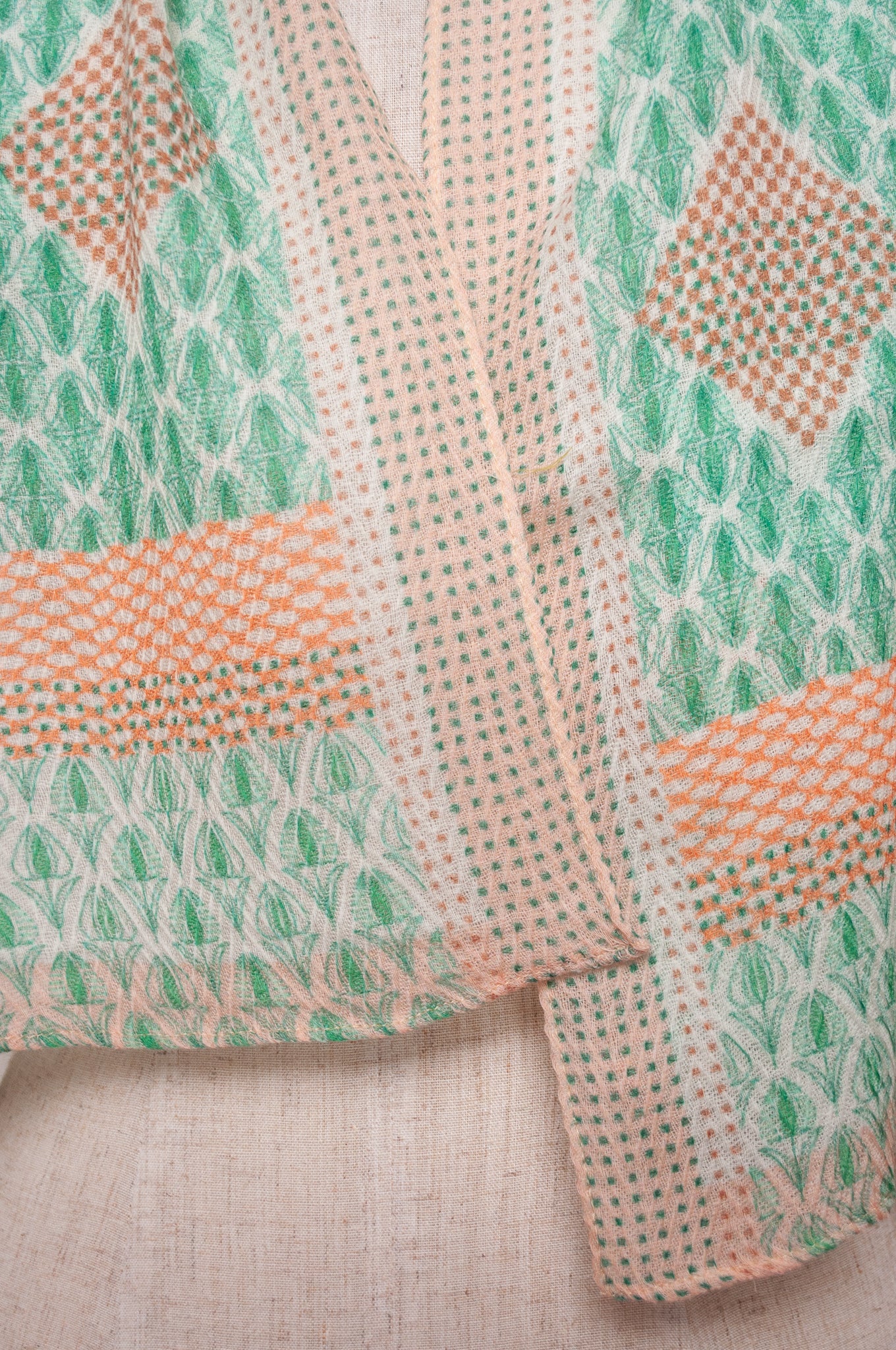 Anna Kaszer fine wool scarf Pouki tonic green and white geometric with coral highlights.