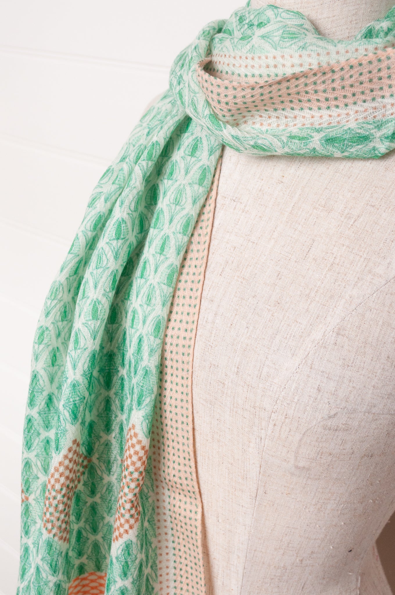 Anna Kaszer fine wool scarf Pouki tonic green and white geometric with coral highlights.