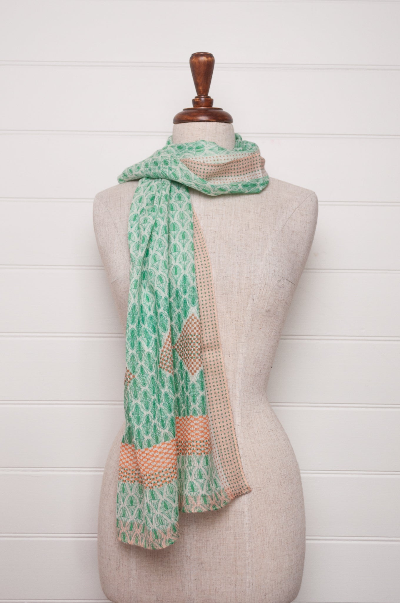 Anna Kaszer fine wool scarf Pouki tonic green and white geometric with coral highlights.