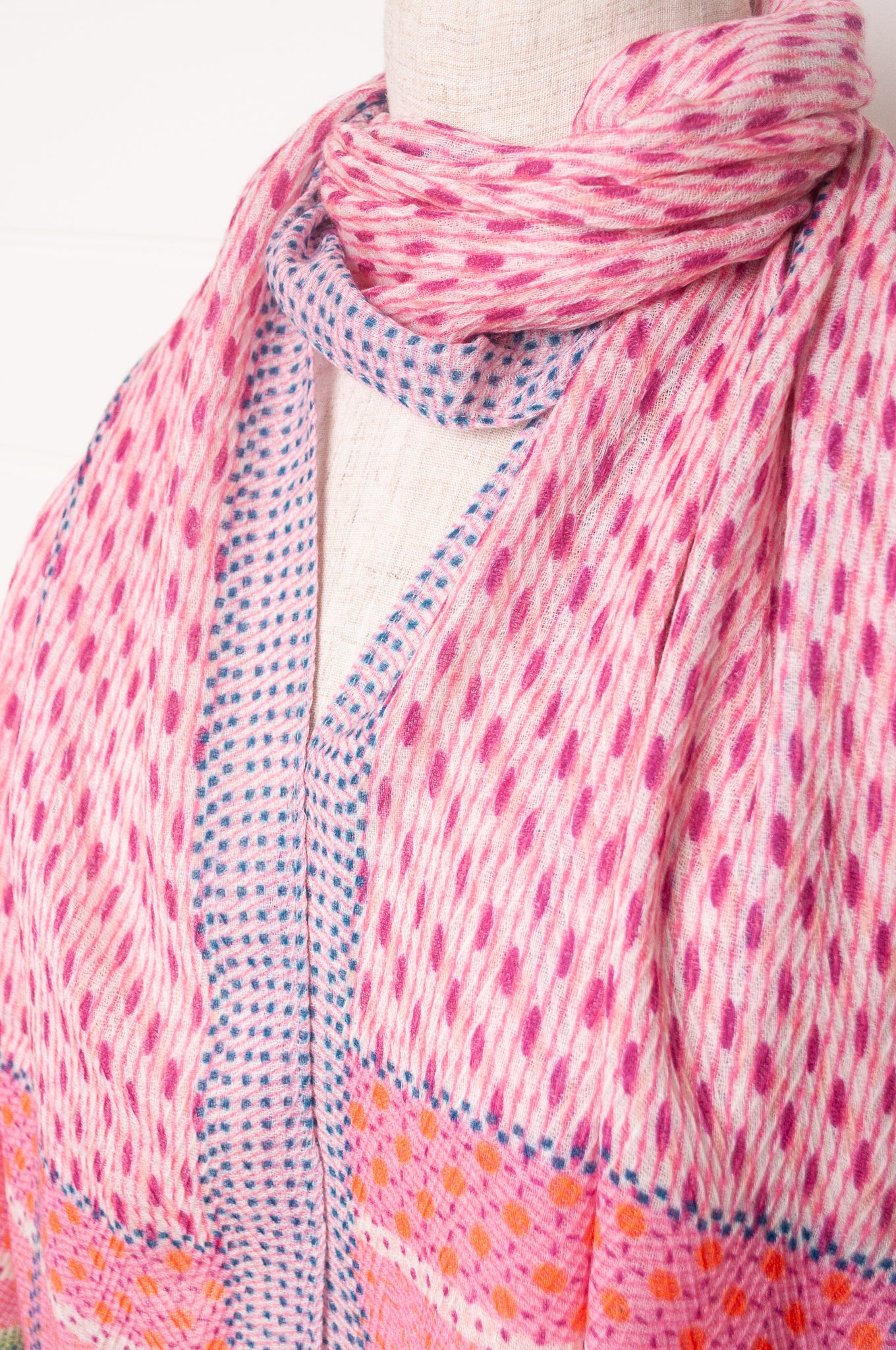 Anna Kaszer fine wool patterned scarf in pink with blue and green highlights.