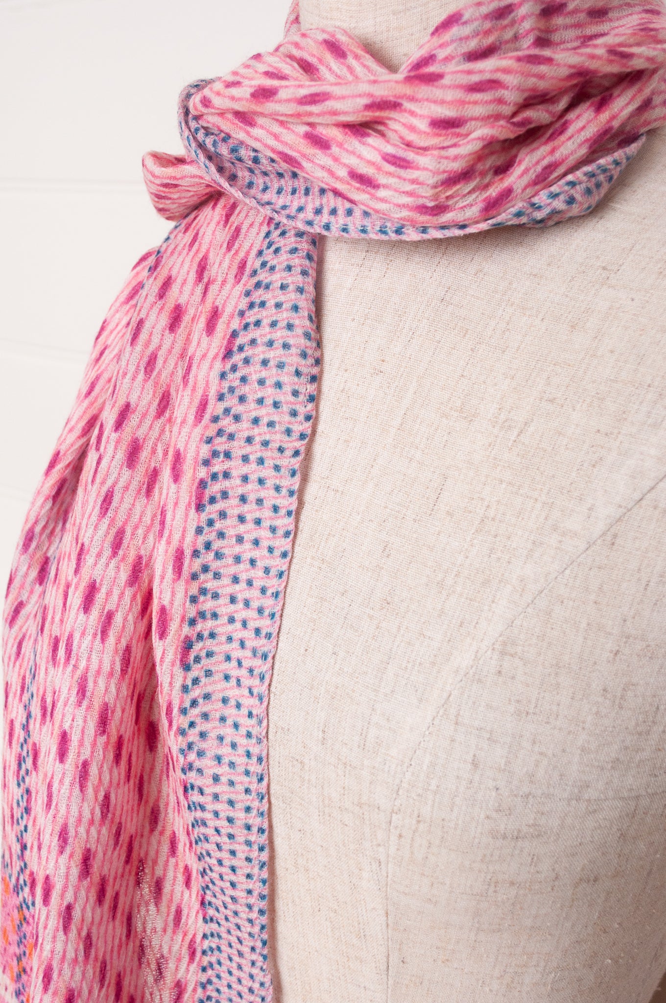 Anna Kaszer fine wool patterned scarf in pink with blue and green highlights.