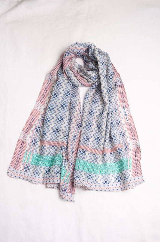 Anna Kaszer fine wool scarf Marti Inosa blue and white geometric flower pattern with green and red highlights.