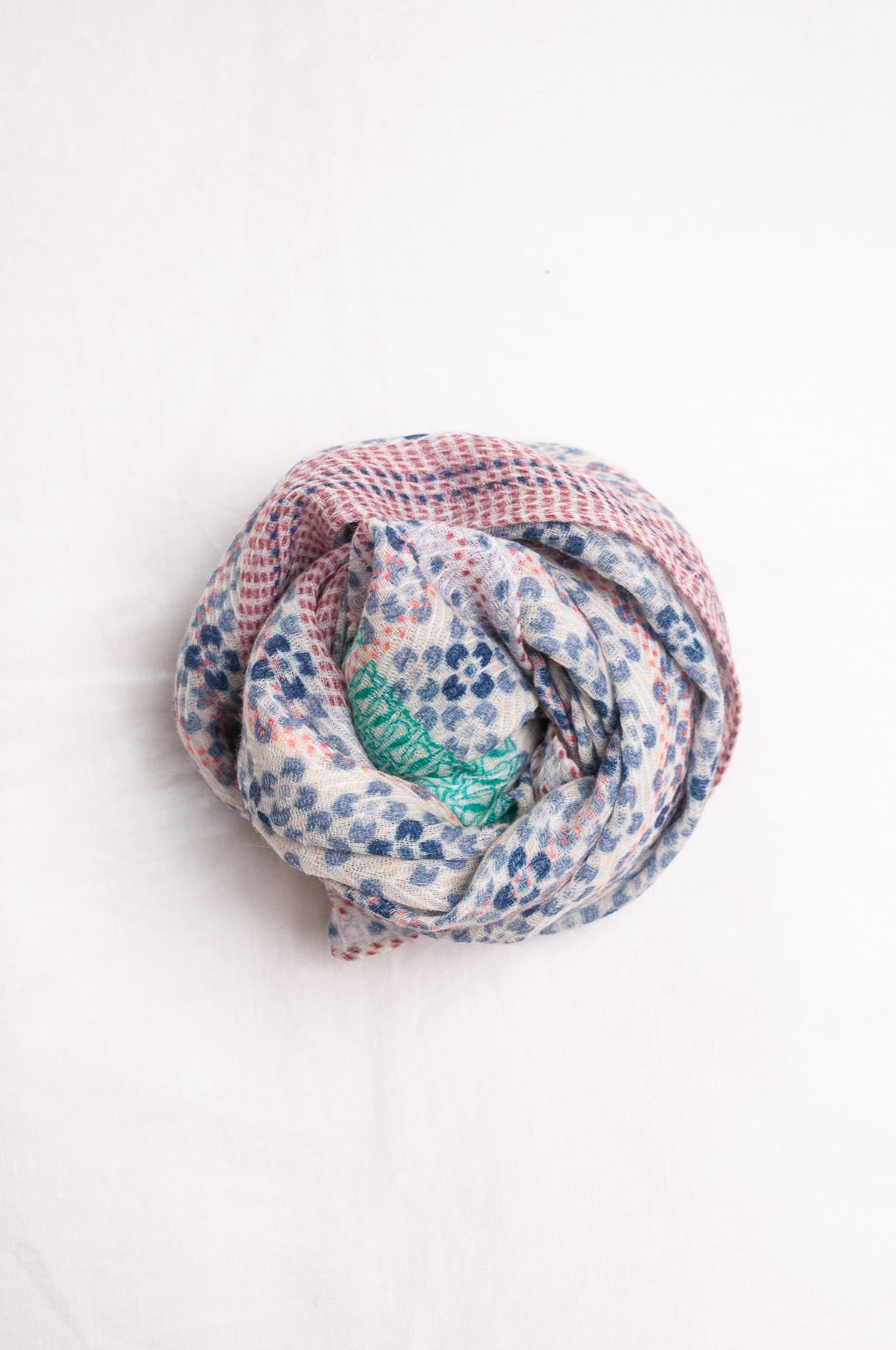 Anna Kaszer fine wool scarf Marti Inosa blue and white geometric flower pattern with green and red highlights.