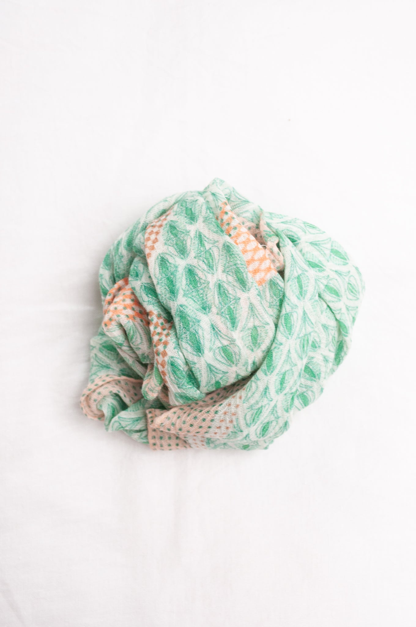 Anna Kaszer fine wool scarf Pouki tonic green and white geometric with coral highlights.