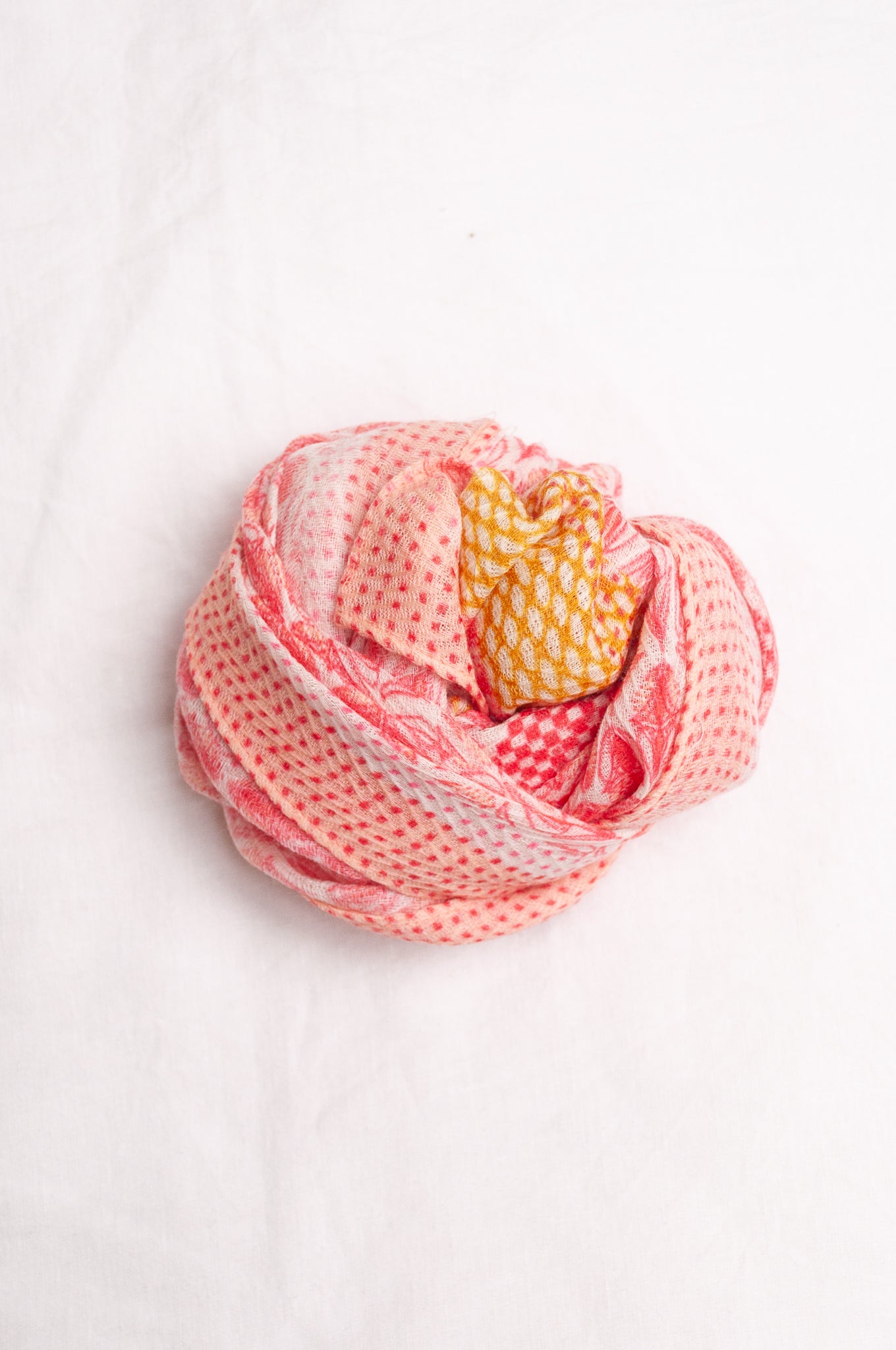 Anna Kaszer fine wool scarf geometric pattern in coral, white and mustard.