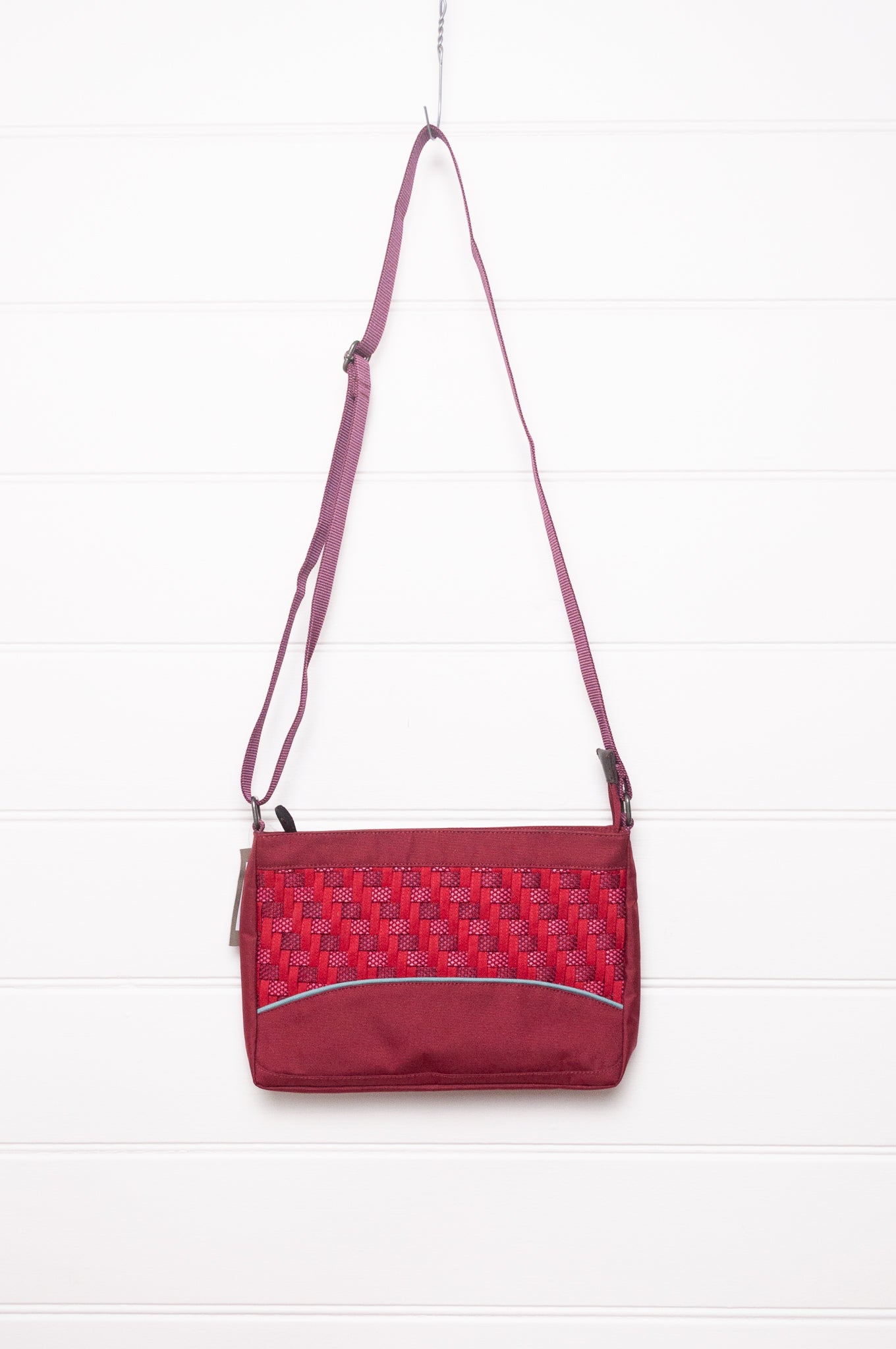 Anna Kaszer Loli red Taki cross body bag with woven braid panel.