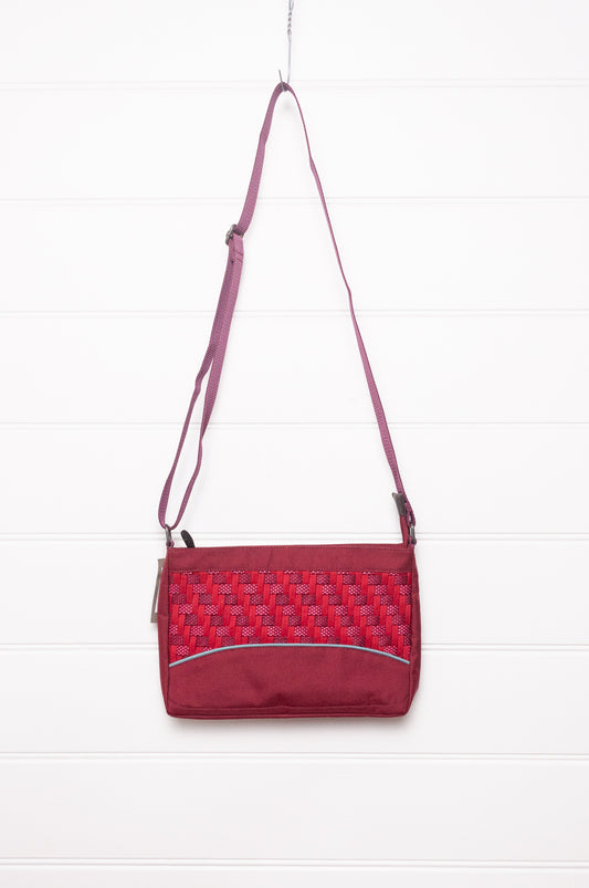 Anna Kaszer Loli red Taki cross body bag with woven braid panel.