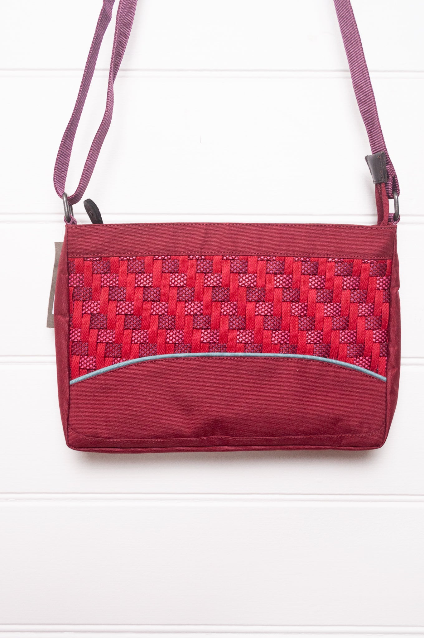 Anna Kaszer Loli red Taki cross body bag with woven braid panel.