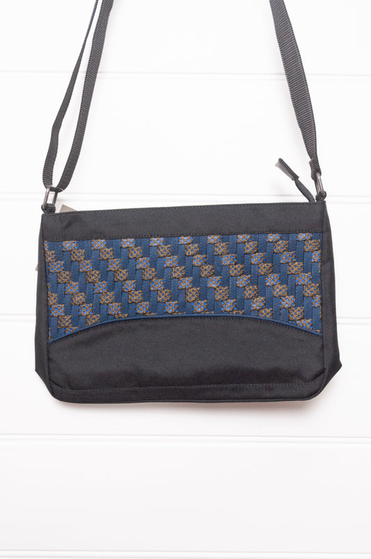 Anna Kaszer Taki small cross body bag in deep navy Night blue, with woven braid panel.