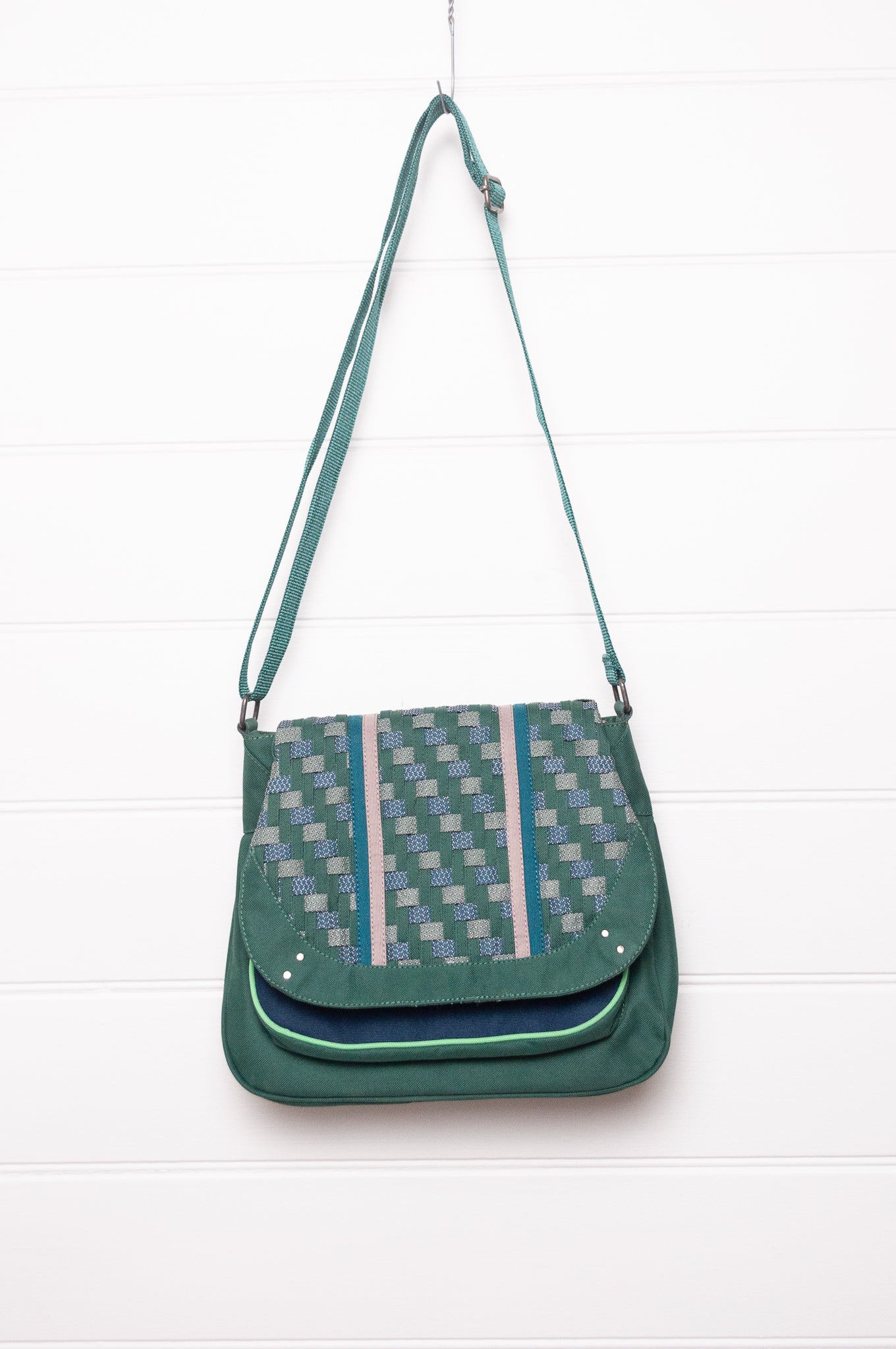 Anna Kaszer Ionza shoulder cross body bag in forest green with woven braid panel.
