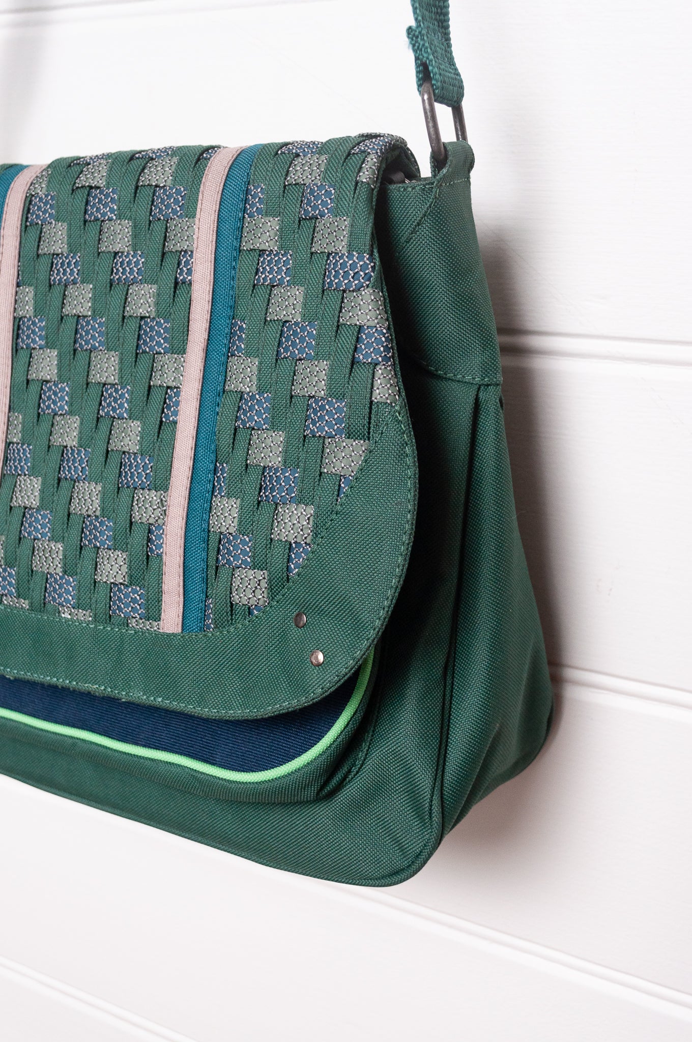 Anna Kaszer Ionza shoulder cross body bag in forest green with woven braid panel.