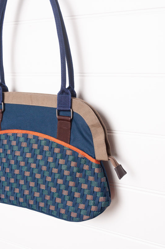 Anna Kaszer Fox bag in navy, taupe and burgundy, with double shoulder straps and woven braid panel.