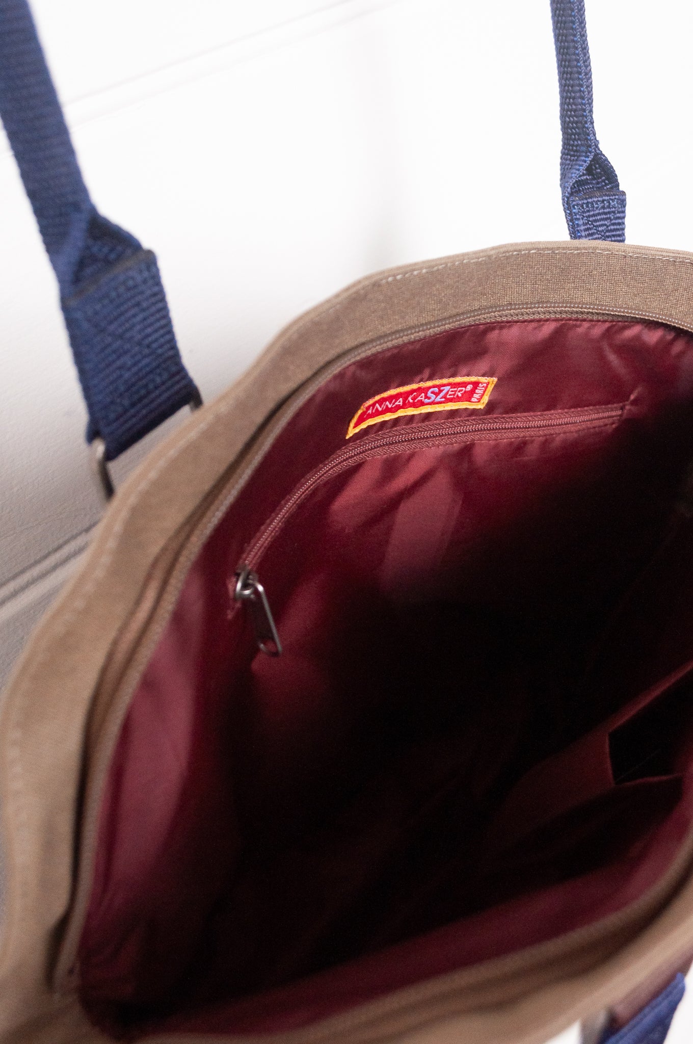 Anna Kaszer Fox bag in navy, taupe and burgundy, with double shoulder straps and woven braid panel.