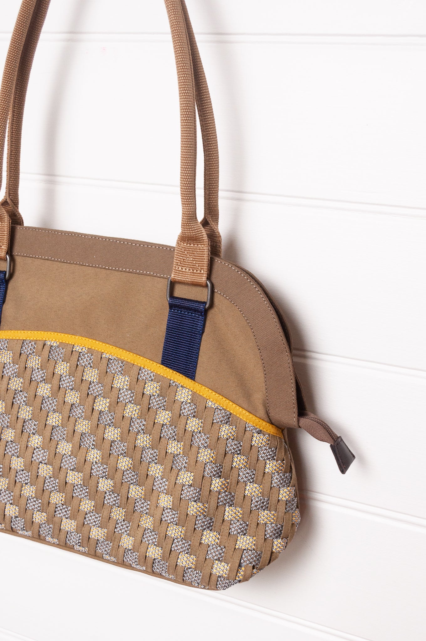Anna Kaszer Fox bag in taupe, with double shoulder straps and woven braid panel.