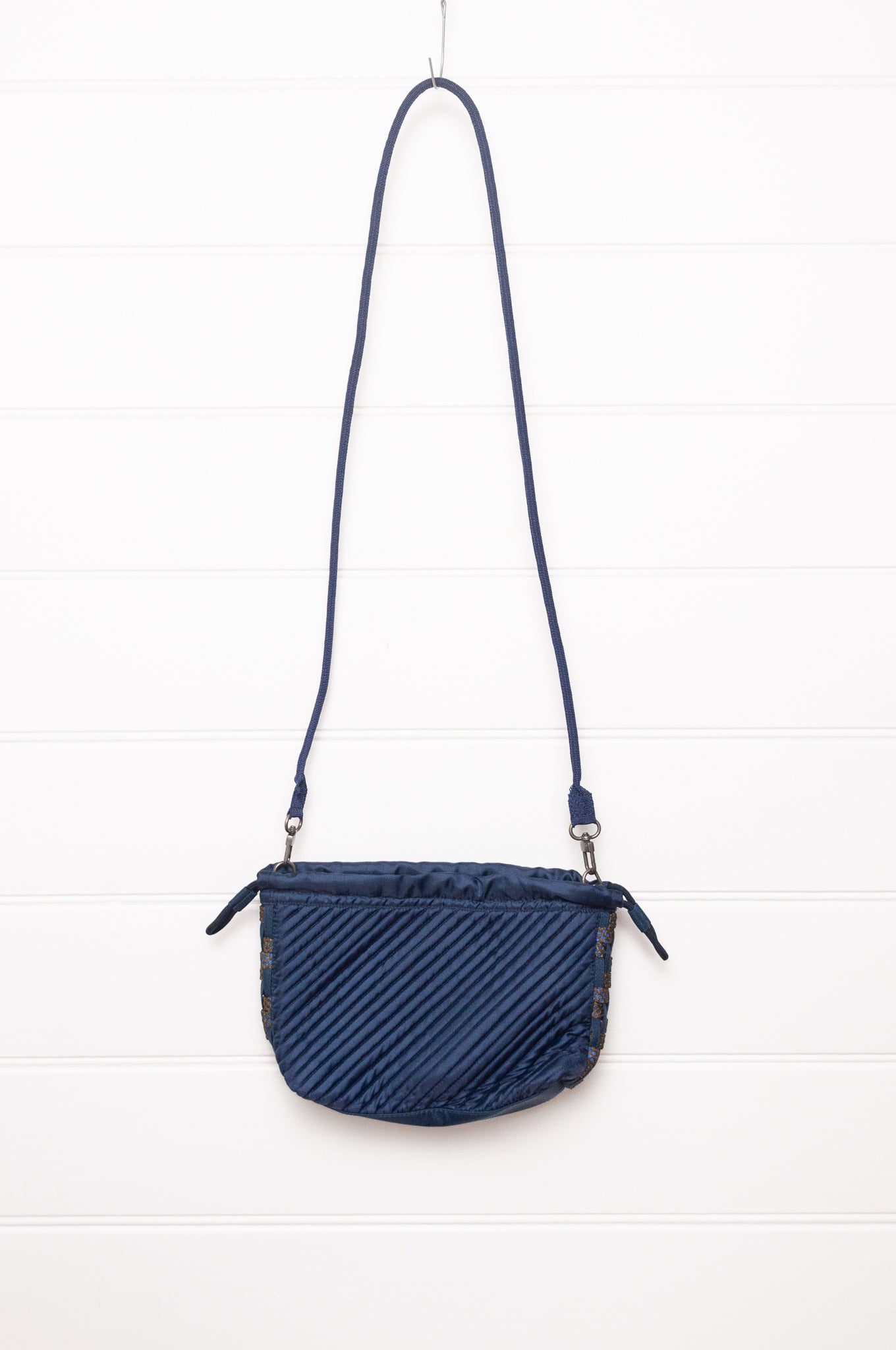 Anna Kaszer quilted Oko drawstring small bag in deep navy Night blue, with woven braid panel.