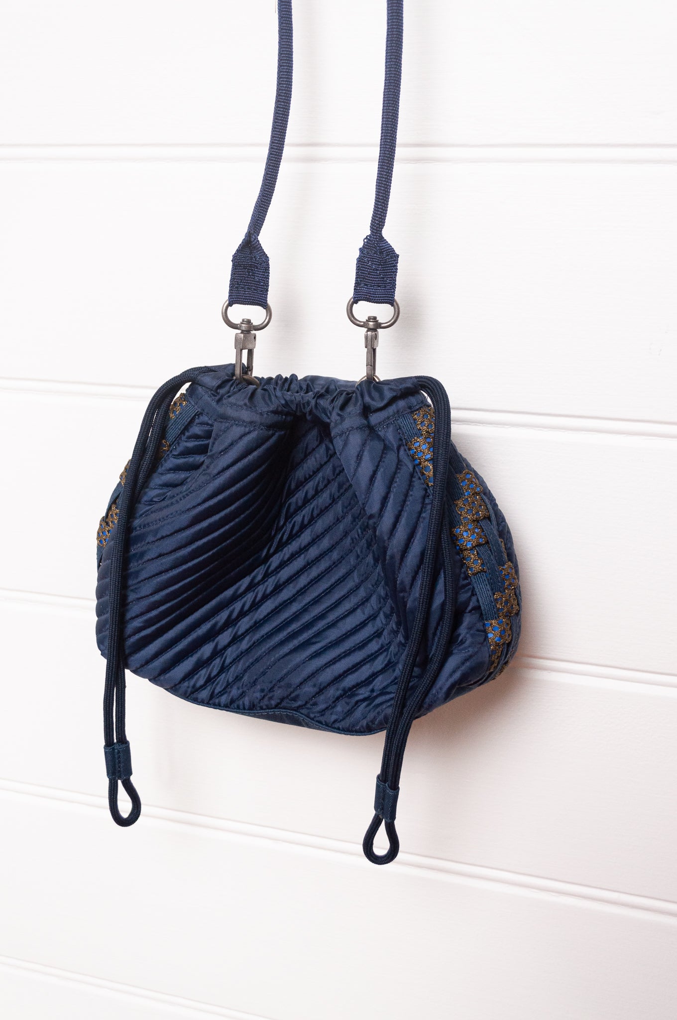 Anna Kaszer quilted Oko drawstring small bag in deep navy Night blue, with woven braid panel.