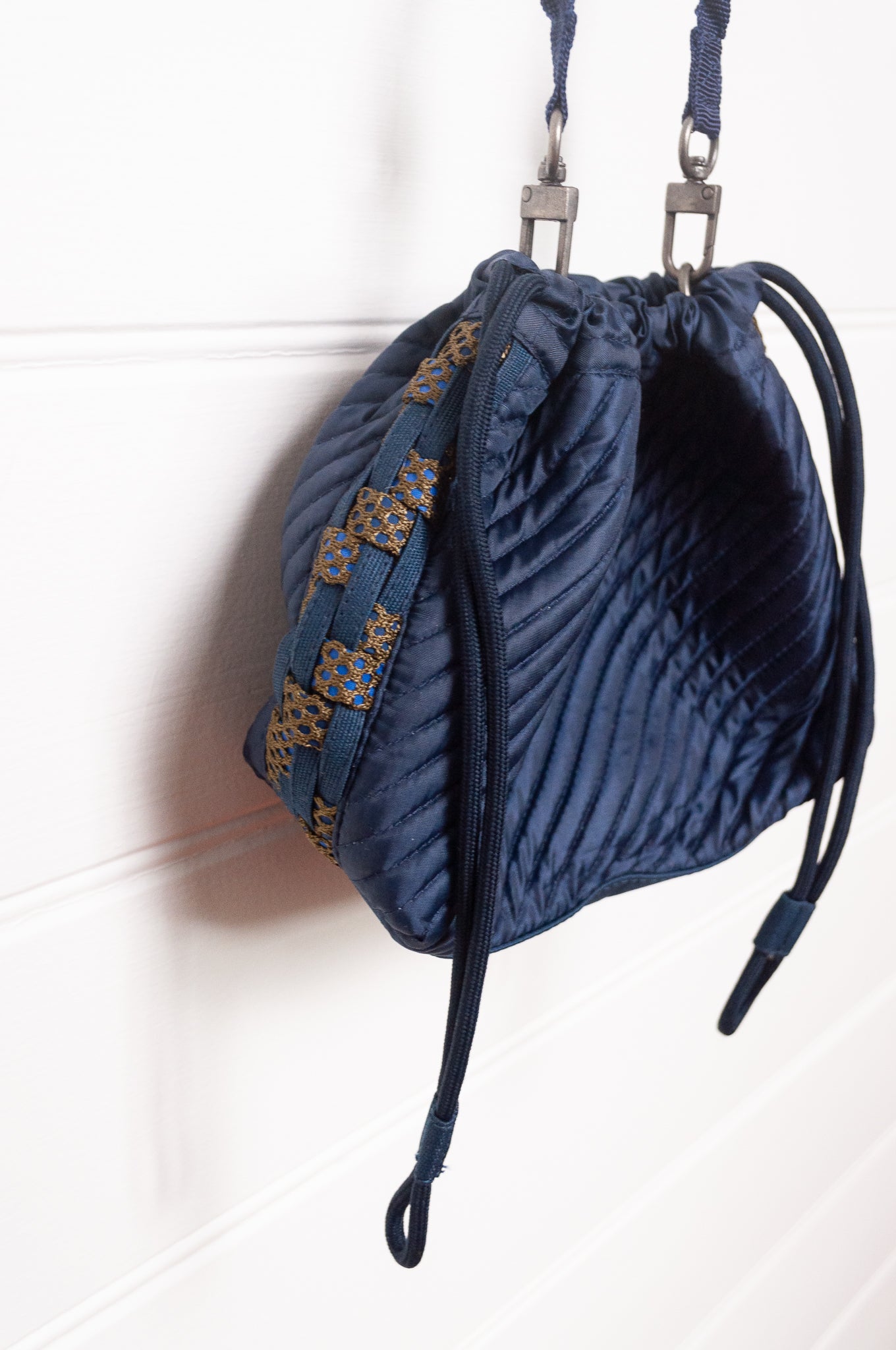 Anna Kaszer quilted Oko drawstring small bag in deep navy Night blue, with woven braid panel.