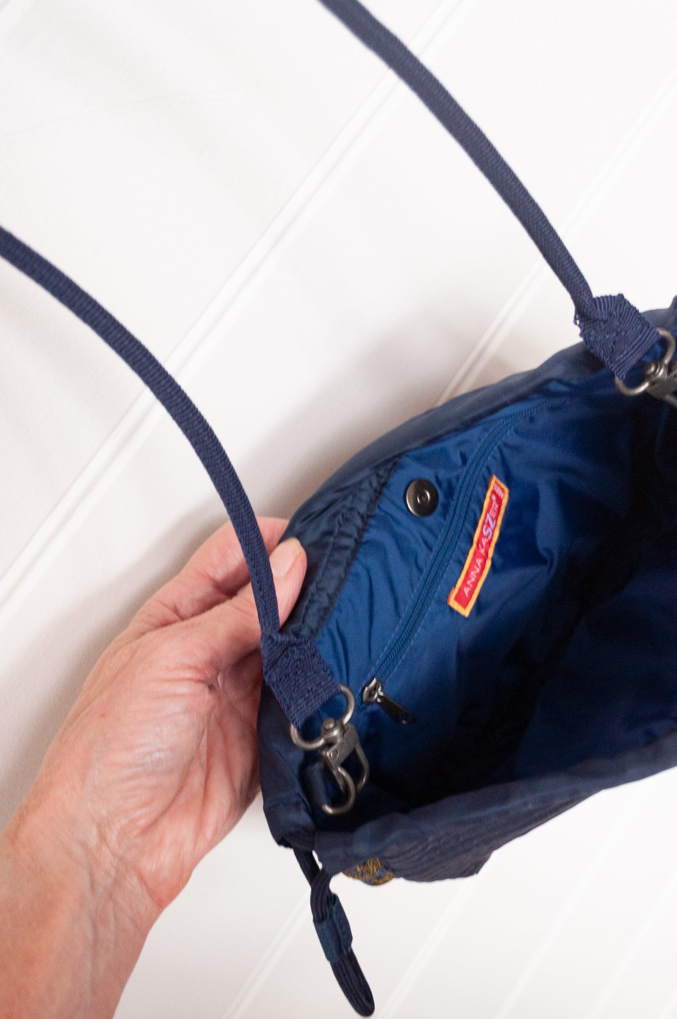 Anna Kaszer quilted Oko drawstring small bag in deep navy Night blue, with woven braid panel.