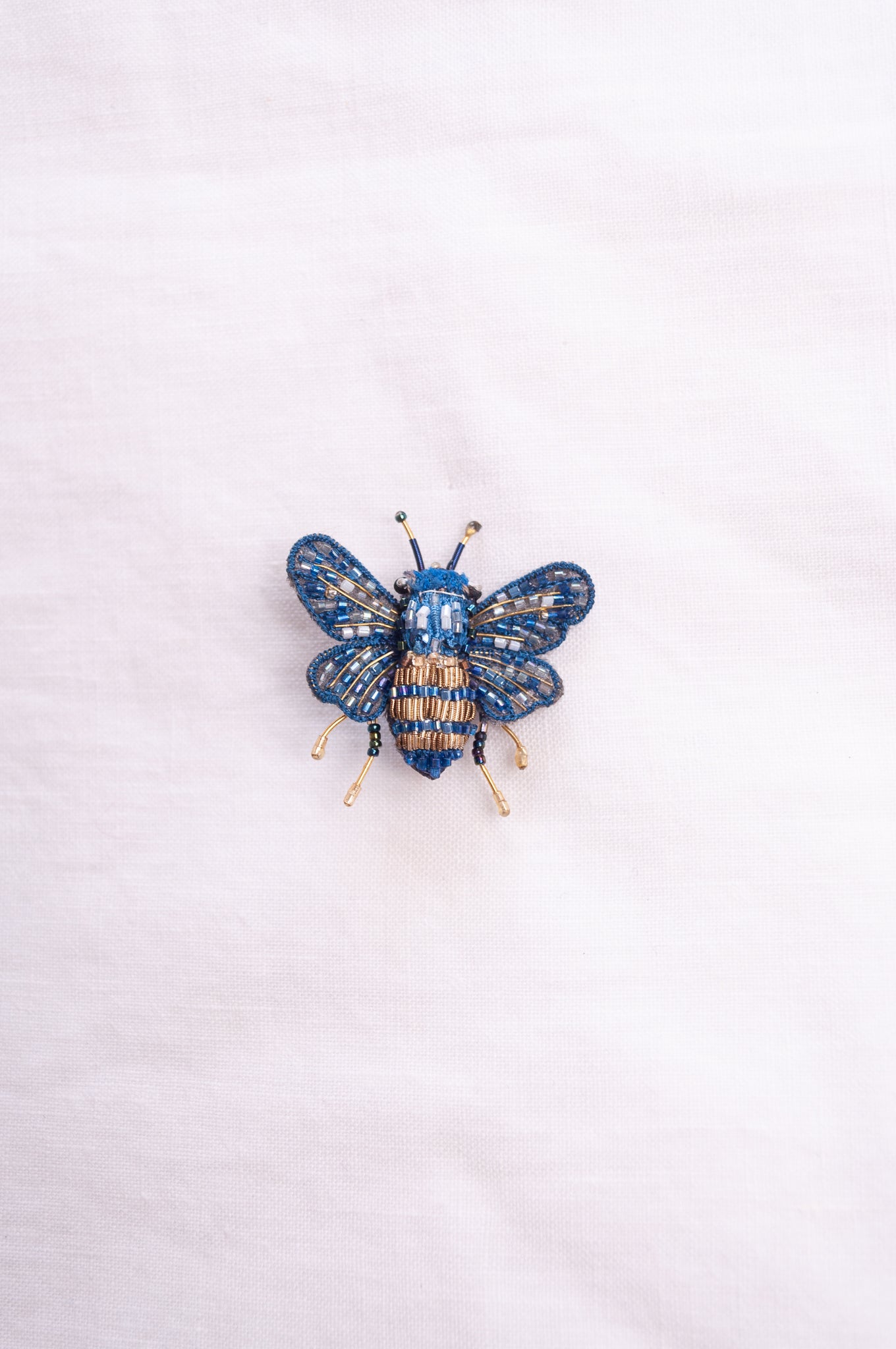 Trovelore hand embroidered and beeded Mason bee brooch.