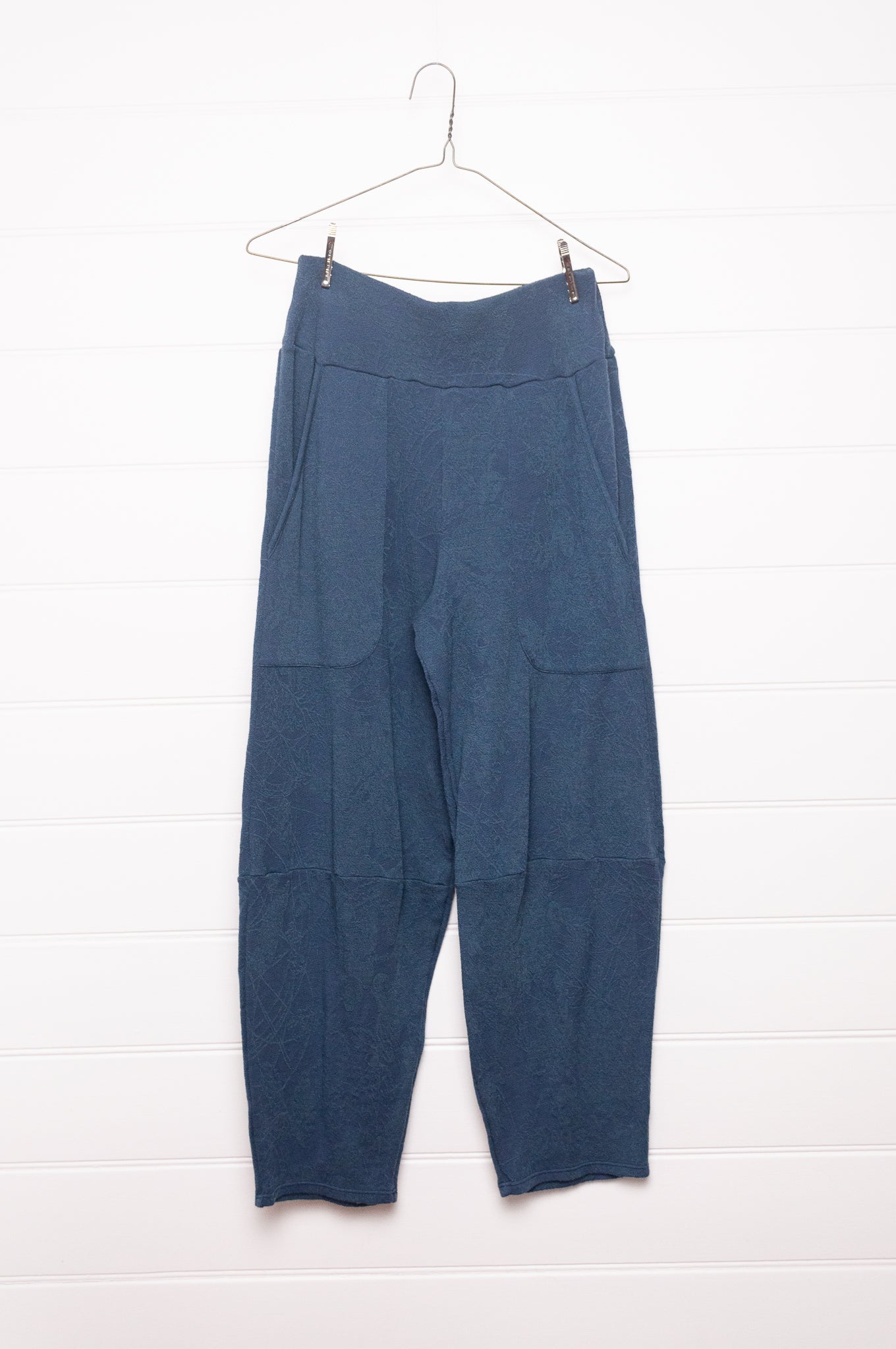 Valia merino wool jacquard knit travel pants in denim blue.